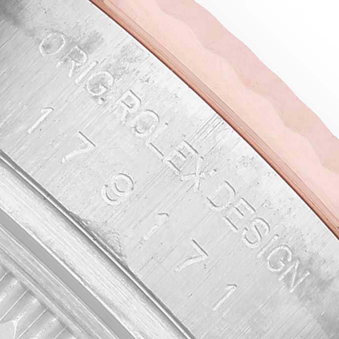 The image shows an angled close-up of the Rolex Datejust 179171 Women's Steel and Gold (two tone) Silver Dial model's case side, focusing on engraved markings.