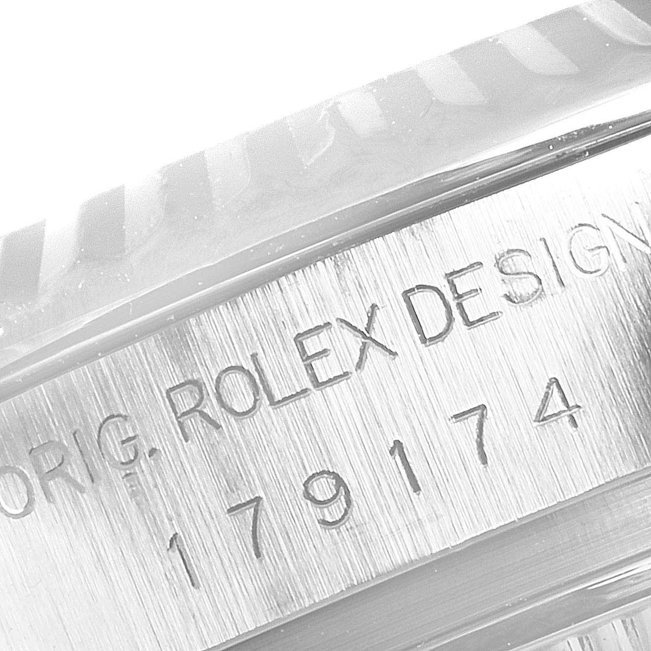 This image shows a close-up angle of the Datejust model by Rolex, focusing on the engraved serial number on the case.