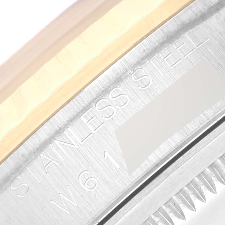 This image shows a close-up of the case back of a Rolex Datejust 16233 Men's Steel and Gold (two tone) Grey Dial 16233 Men's Steel and Gold (two tone) Grey Dial watch, highlighting the "Stainless Steel" engraving.