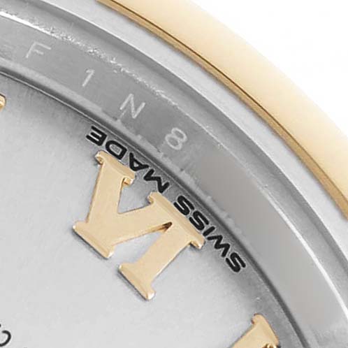 The image shows a partial view of the dial and bezel of a Rolex Datejust 279163 Women's Steel and Gold (two tone) Silver Dial watch, featuring Roman numerals and "SWISS MADE" text.