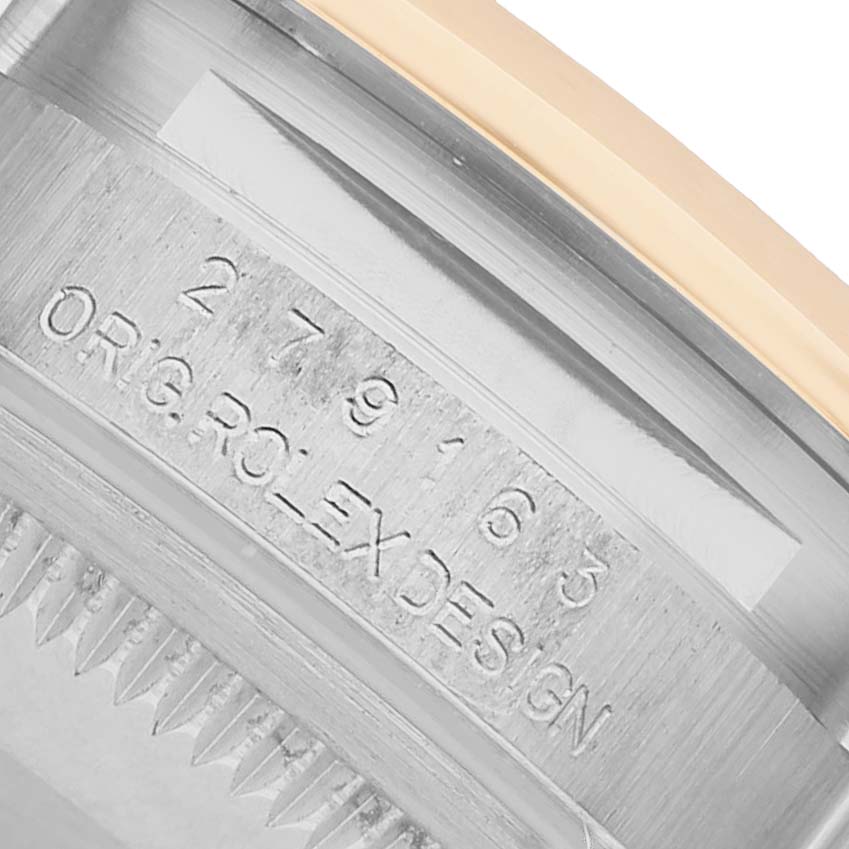 The image shows a close-up of the Rolex Datejust 279163 Women's Steel and Gold (two tone) Silver Dial watch's reference number engraving on its case, viewed from the side.