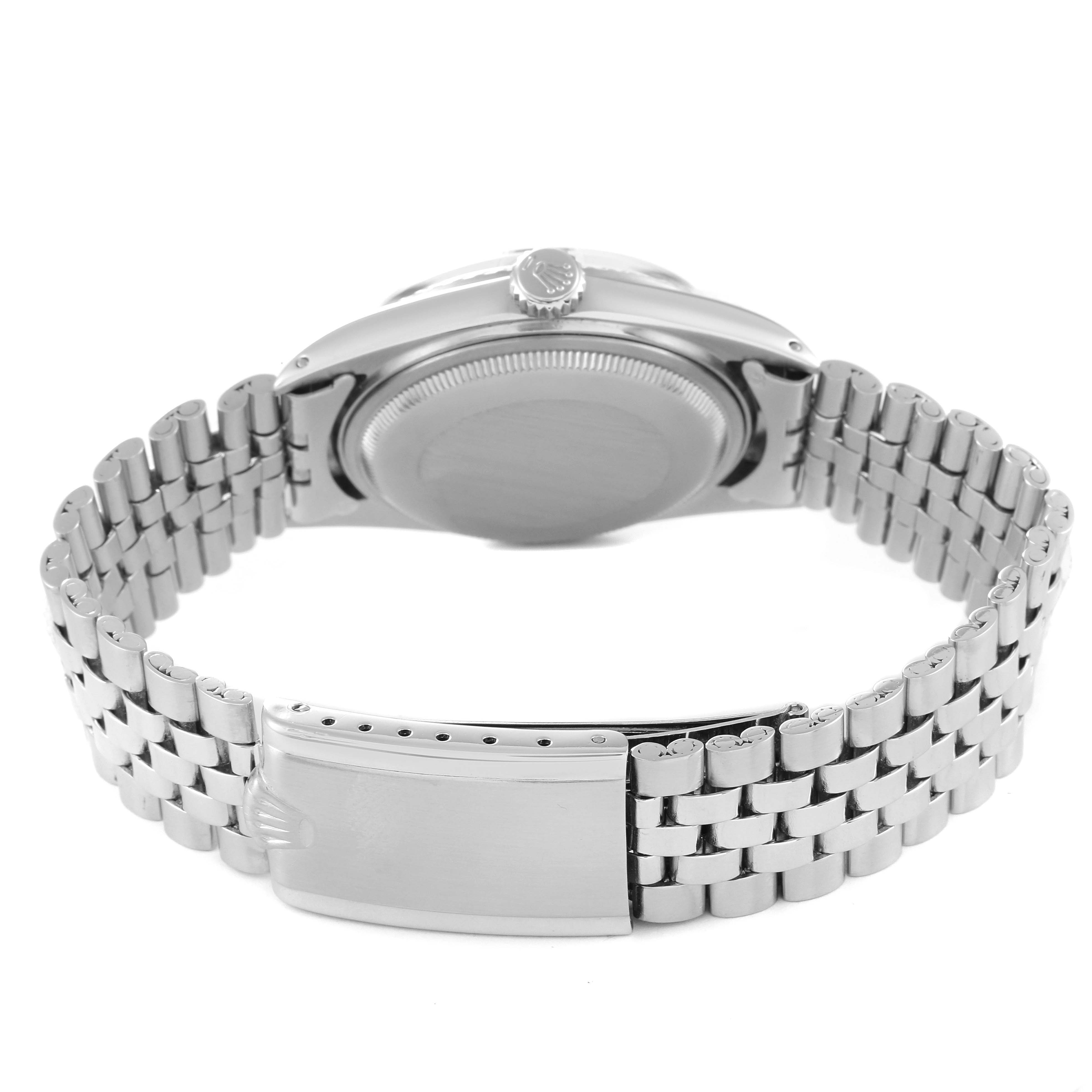 This Vintage Collection Rolex watch is shown from the back, highlighting the case back and metal bracelet with clasp.