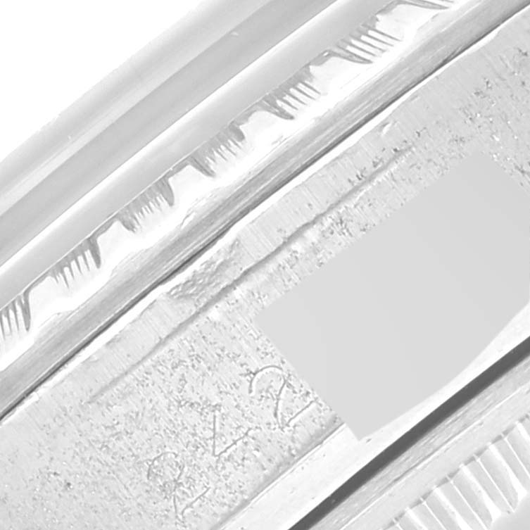 This close-up image shows the embossed details on the bezel of a Vintage Collection model by Rolex.