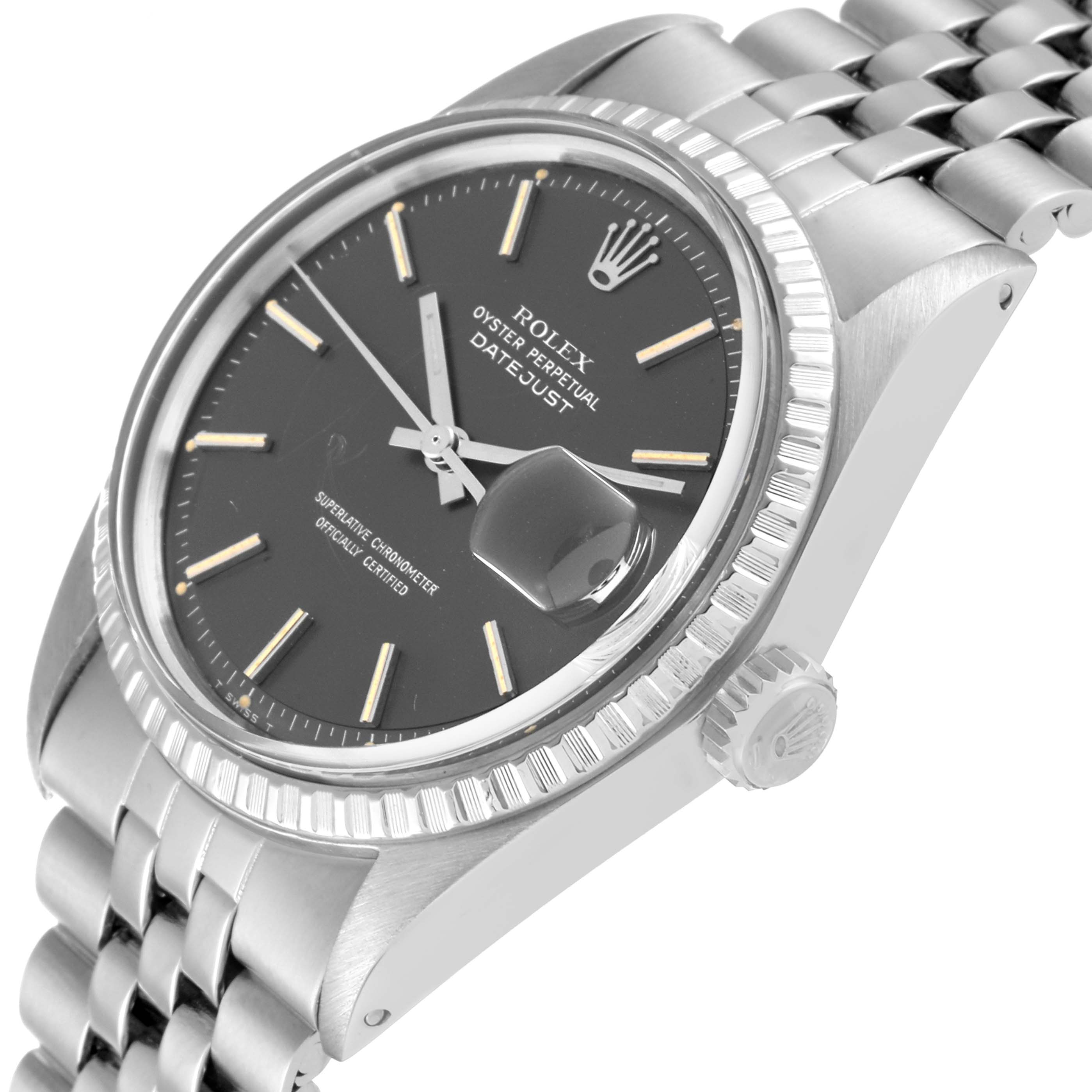 The image shows a close-up of the face and bezel of a Rolex Vintage Collection 1603 Men's Stainless Steel Grey Dial 1603 Men's Stainless Steel Grey Dial Datejust watch, highlighting its dial, crown, and part of the bracelet.