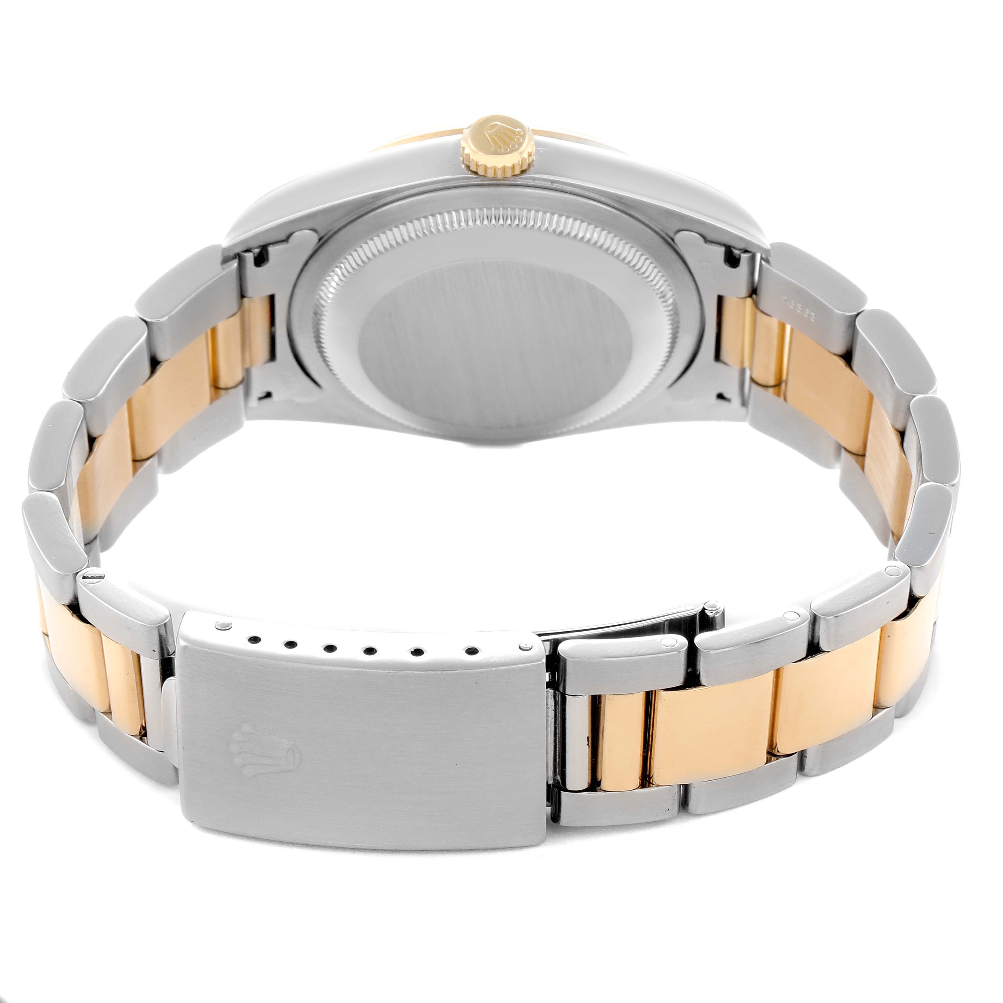 The Rolex Datejust 16203 Men
s Steel and Gold (two tone) Mother of Pearl Dial watch is shown from the rear angle, highlighting the bracelet, clasp, case back, and crown.