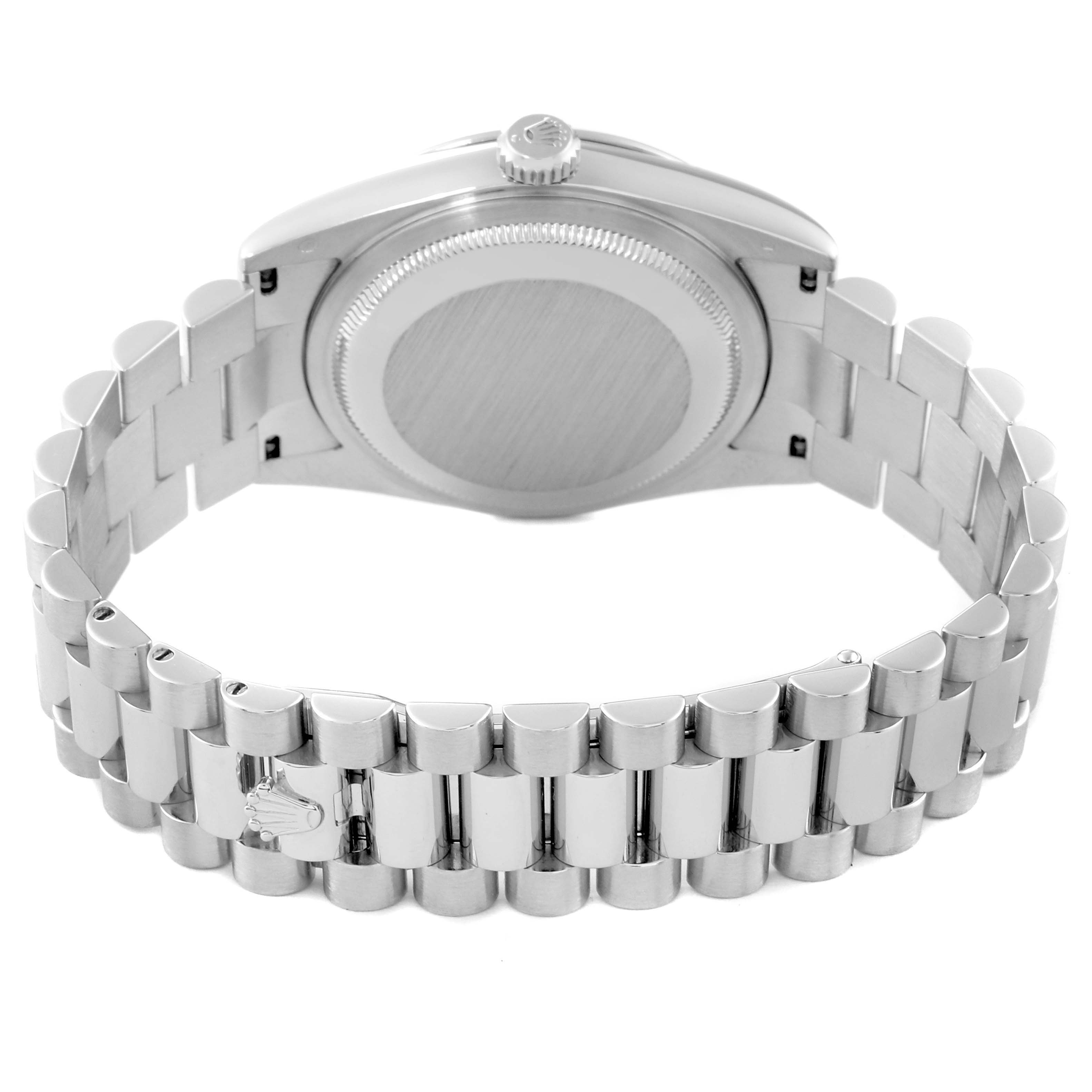 The image shows the President model by Rolex from the back, highlighting the back case and the linked bracelet.