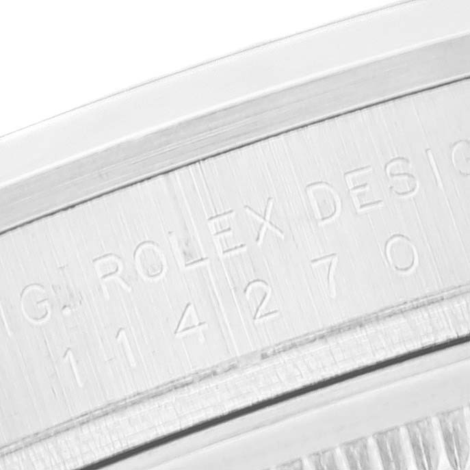 This close-up image shows the engraved model number on the case of a Rolex Explorer 114270 Men's Stainless Steel Black Dial 114270 Men's Stainless Steel Black Dial watch.