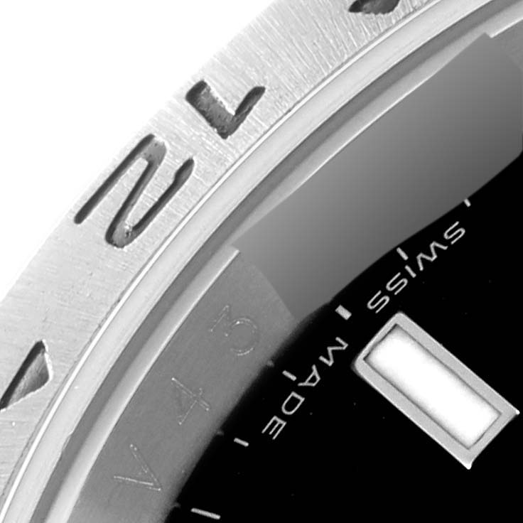 This is a close-up of the bezel and part of the dial of the Rolex Explorer 16570 Men's Stainless Steel Black Dial 16570 Men's Stainless Steel Black Dial watch.