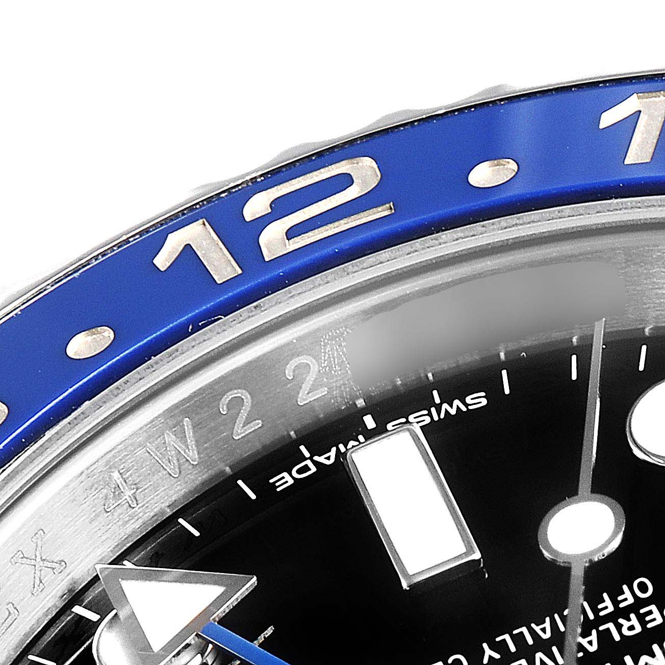 Close-up view of the Rolex GMT-Master 116710 Men's Stainless Steel Black Dial 116710 Men's Stainless Steel Black Dial watch, showing part of the bezel, dial, and hour markers.