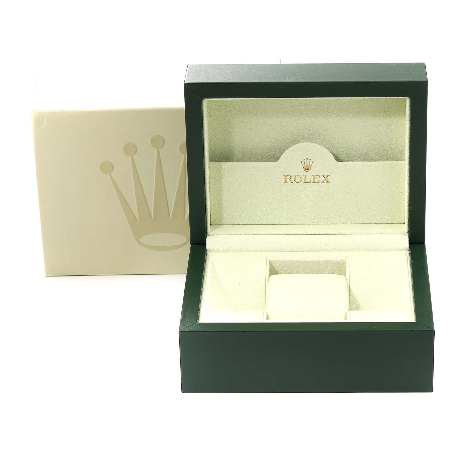 The image shows an open green and cream-colored Rolex box for the Oyster Perpetual model, positioned at a front angle.