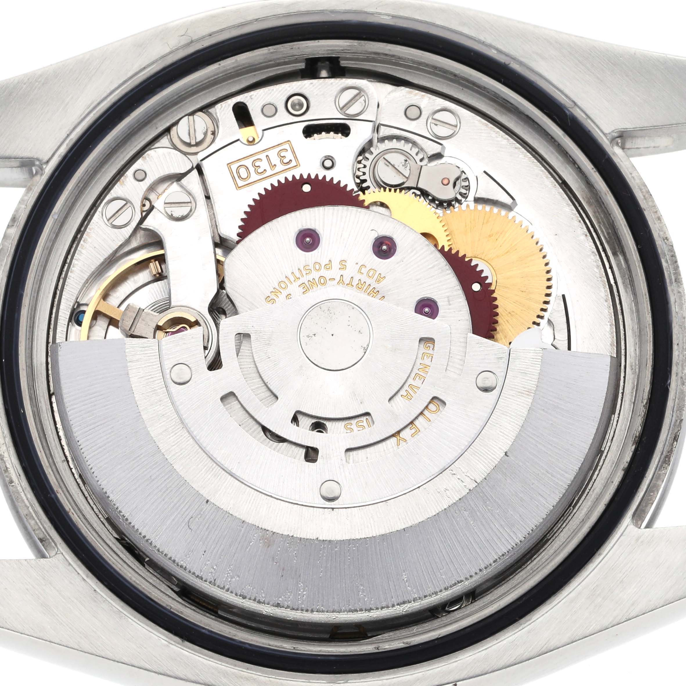 This image shows a close-up of the internal movement components of a Rolex Oyster Perpetual 116000 Men
s Stainless Steel Black Dial 116000 Men
s Stainless Steel Black Dial watch, displaying gears and the rotor.