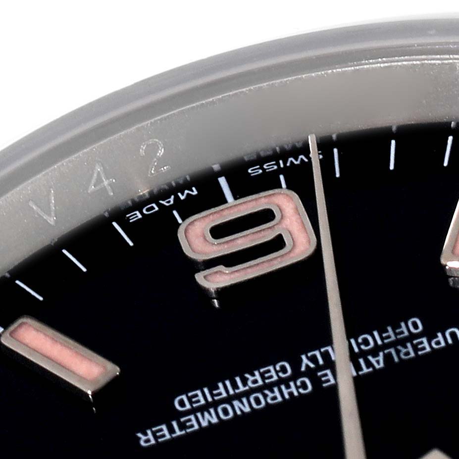 Close-up angle showing the dial with a section of numbers and text, as well as the edge of the bezel of the Rolex Oyster Perpetual 116000 Men
s Stainless Steel Black Dial 116000 Men
s Stainless Steel Black Dial watch.