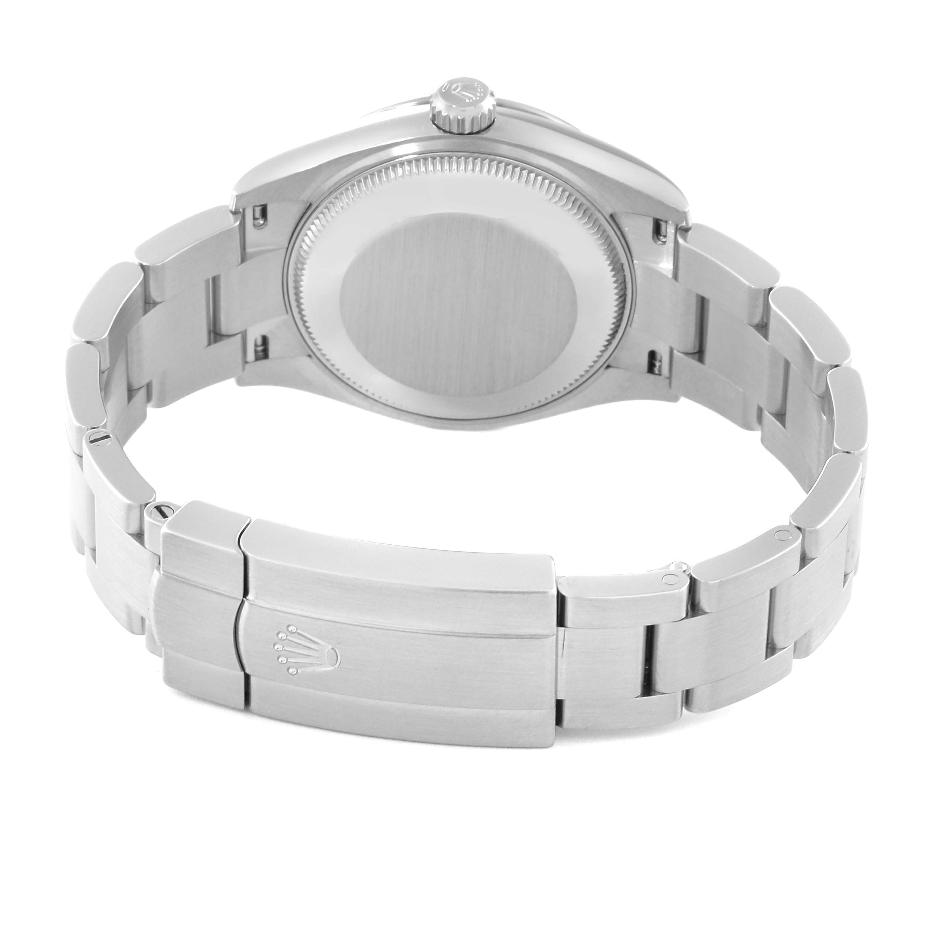 The image shows the back view of a Rolex Oyster Perpetual watch, displaying the case back, bracelet, and clasp.