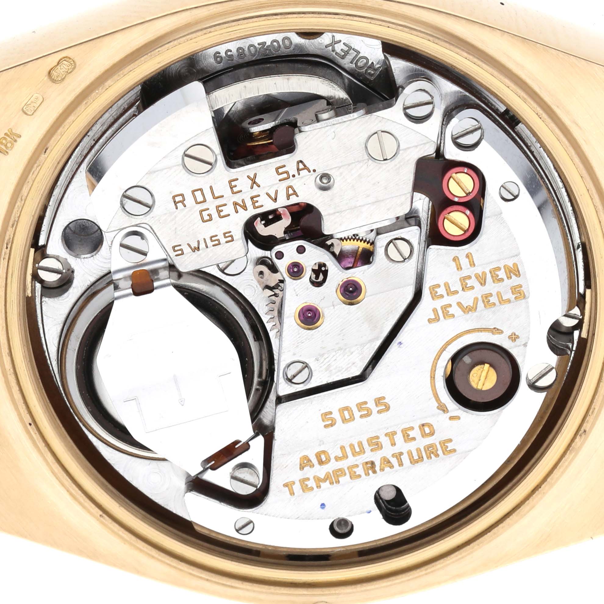 The image shows the internal mechanism of a Rolex Oysterquartz 19018 Men's Yellow Gold White Dial 19018 Men's Yellow Gold White Dial watch at a close-up angle, focusing on its components and engravings.