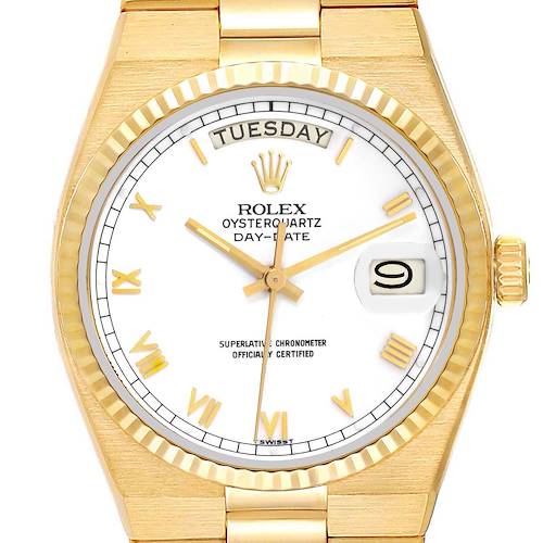 The image shows a frontal view of a Rolex Oysterquartz watch, highlighting its dial, hands, bezel, day, and date indicators.