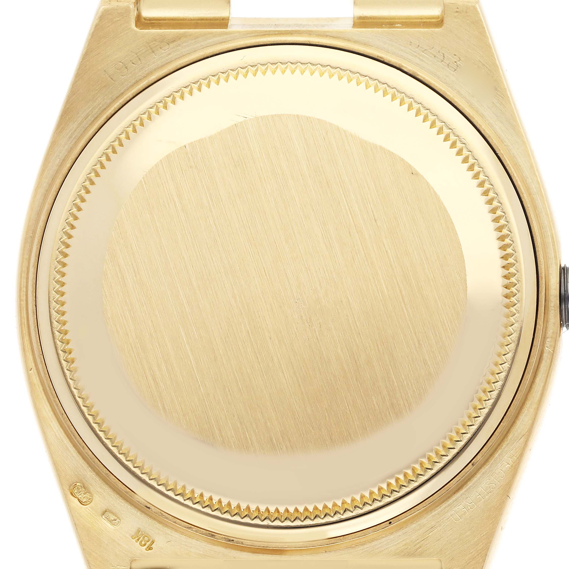 This image shows the case back of a Rolex Oysterquartz 19018 Men's Yellow Gold White Dial 19018 Men's Yellow Gold White Dial watch from a direct overhead angle.