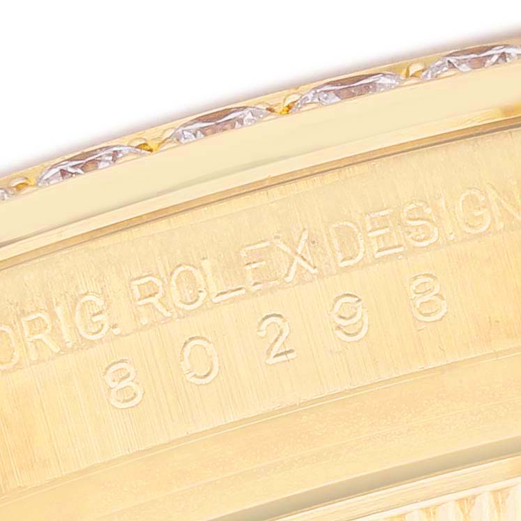 The image shows a close-up of the engraved inner bezel of a Rolex Pearlmaster 80298 Women's Yellow Gold Champagne Dial watch.