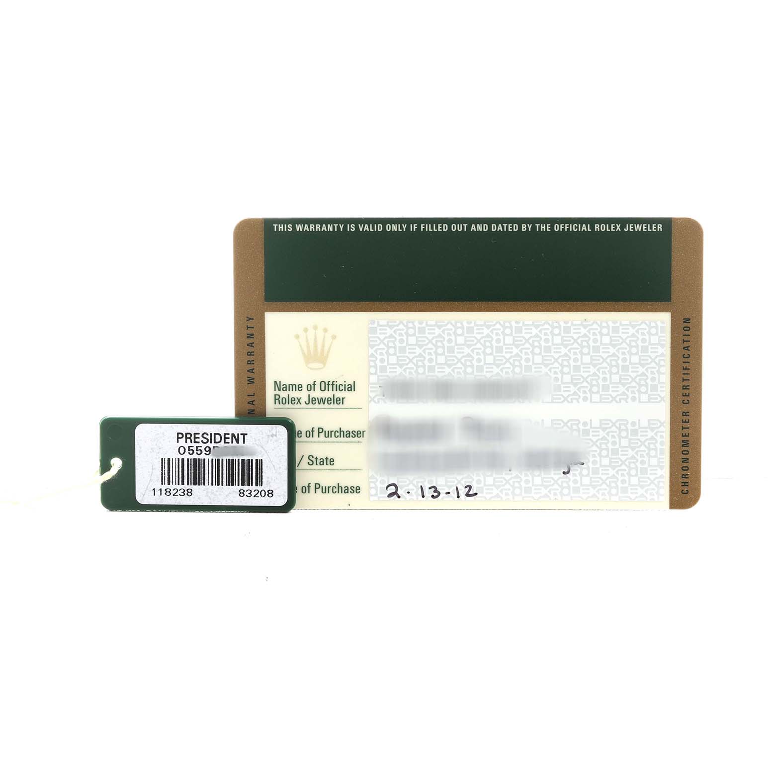 The image shows a Rolex President 118238 Men's Yellow Gold Silver Dial warranty card and a tag with model information, viewed from above.