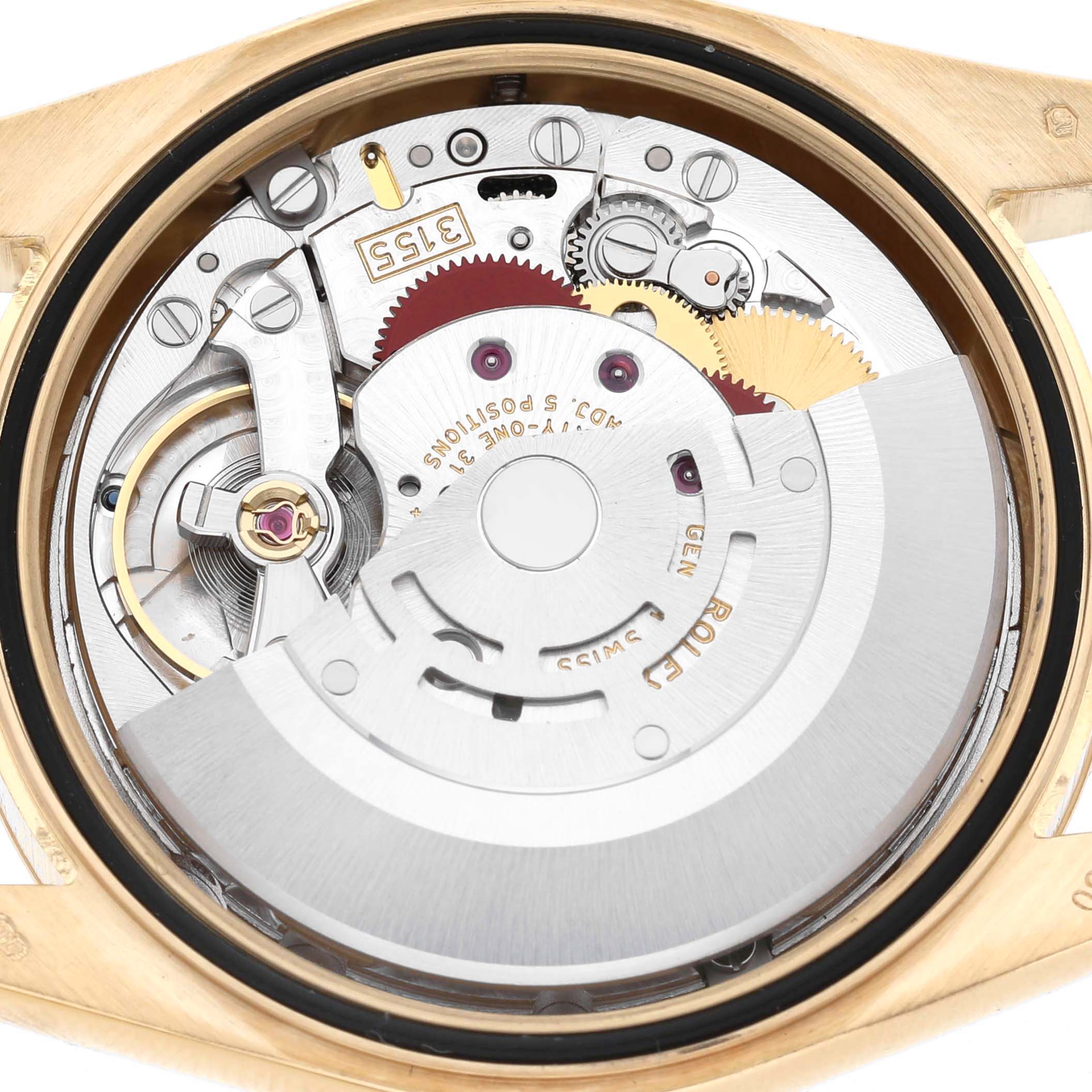 The image shows the movement of a Rolex President 118238 Men's Yellow Gold Silver Dial model from the back, highlighting gears and the rotor.