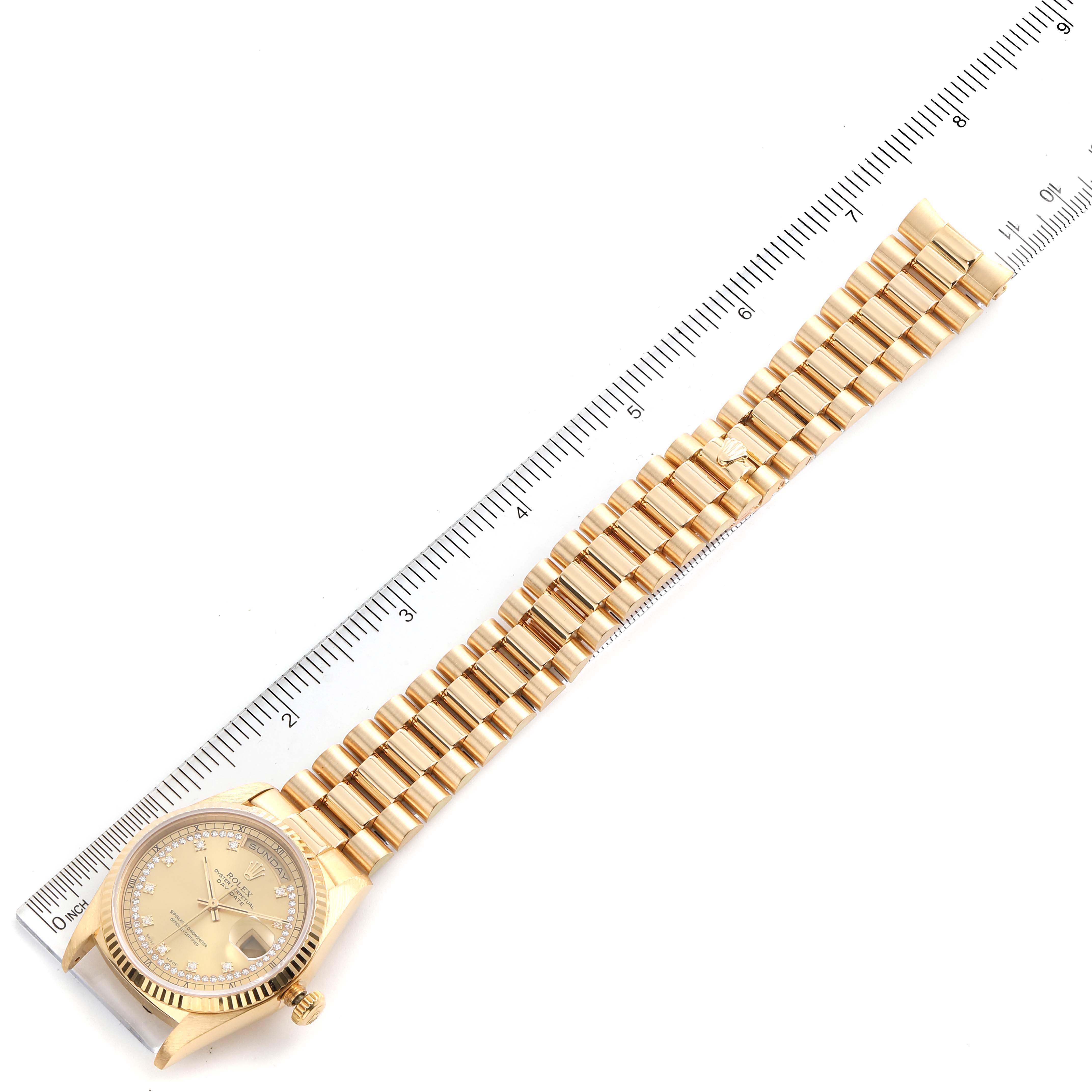 The image shows a top-down view of a Rolex President 18238 Men's Yellow Gold Champagne Dial 18238 Men's Yellow Gold Champagne Dial model watch, highlighting the gold bracelet and dial.
