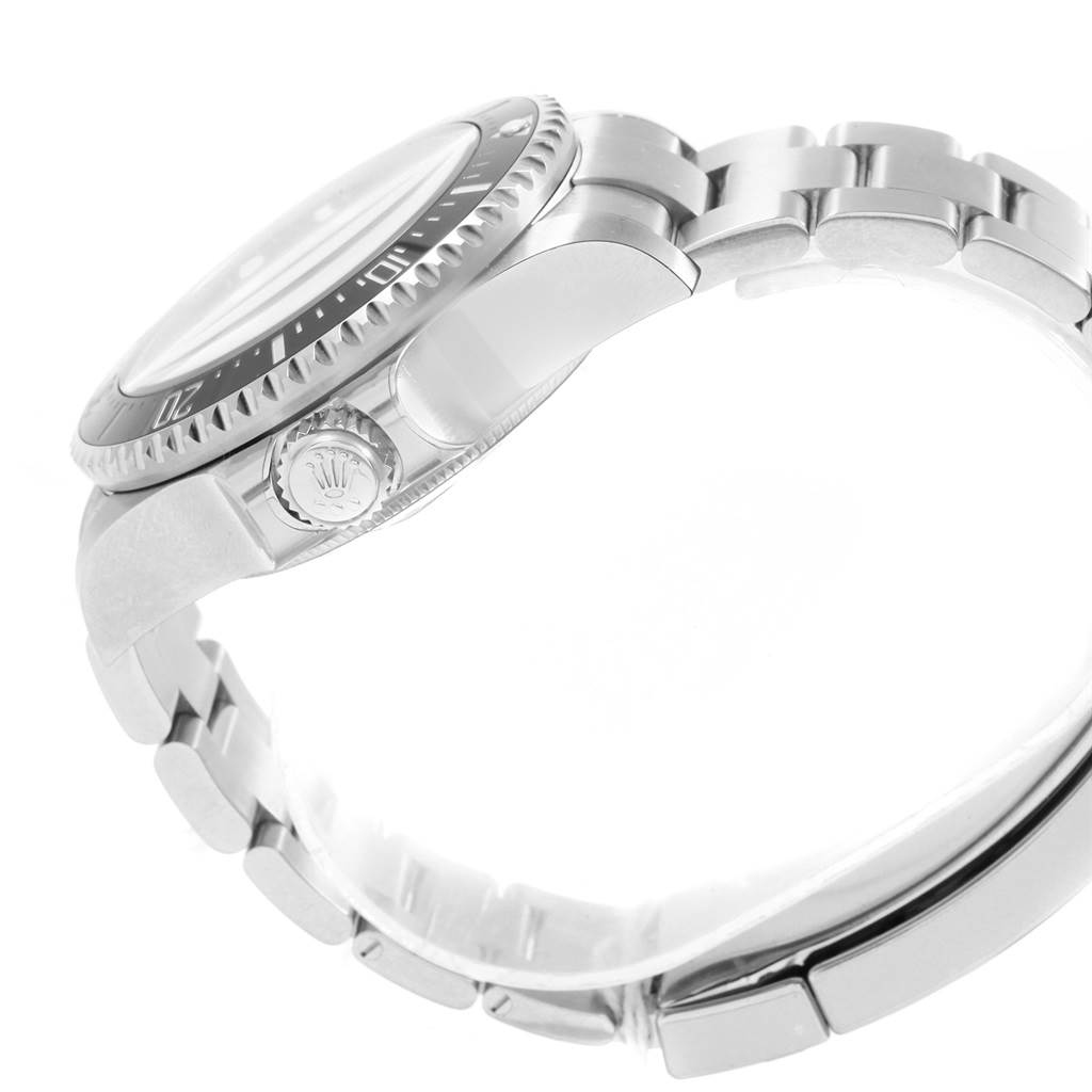 The image shows a side view of a Rolex Sea-Dweller 126660 Men
s Stainless Steel Black Dial 126660 Men
s Stainless Steel Black Dial, focusing on the crown, bezel, and part of the bracelet.