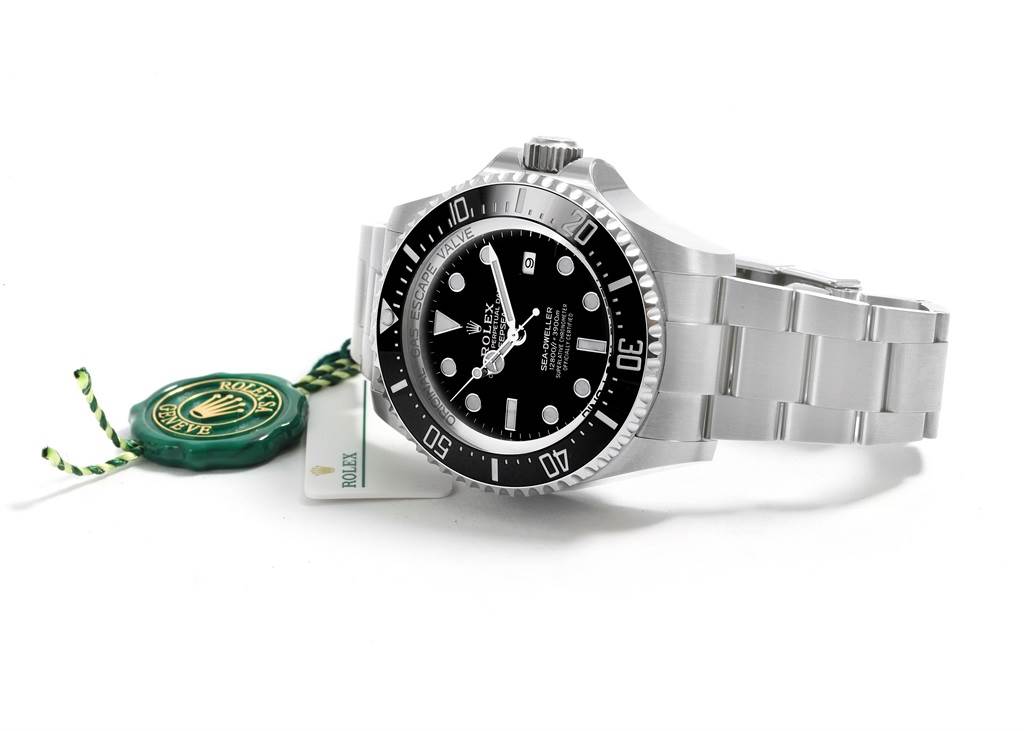 The image shows a Rolex Sea-Dweller 126660 Men
s Stainless Steel Black Dial 126660 Men
s Stainless Steel Black Dial watch at a three-quarter angle displaying the dial, bezel, bracelet, and a Rolex tag.