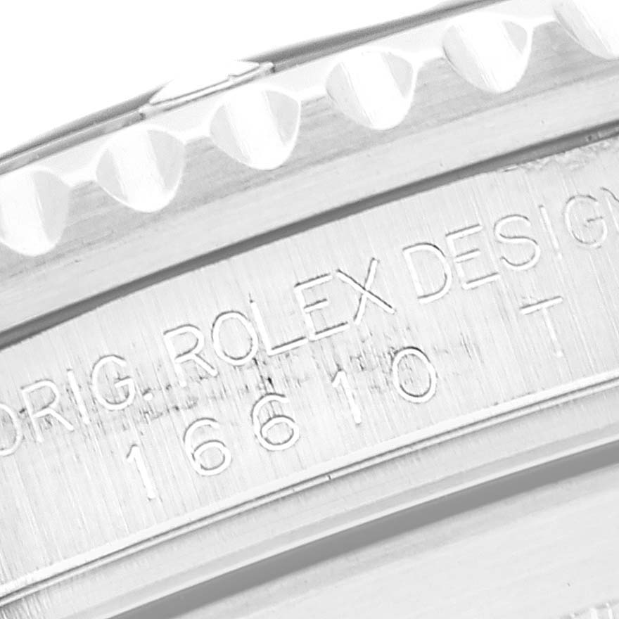 This close-up image shows the engraved model details on the side of a Rolex Submariner 16610 Men
s Stainless Steel Black Dial 16610 Men
s Stainless Steel Black Dial watch case.