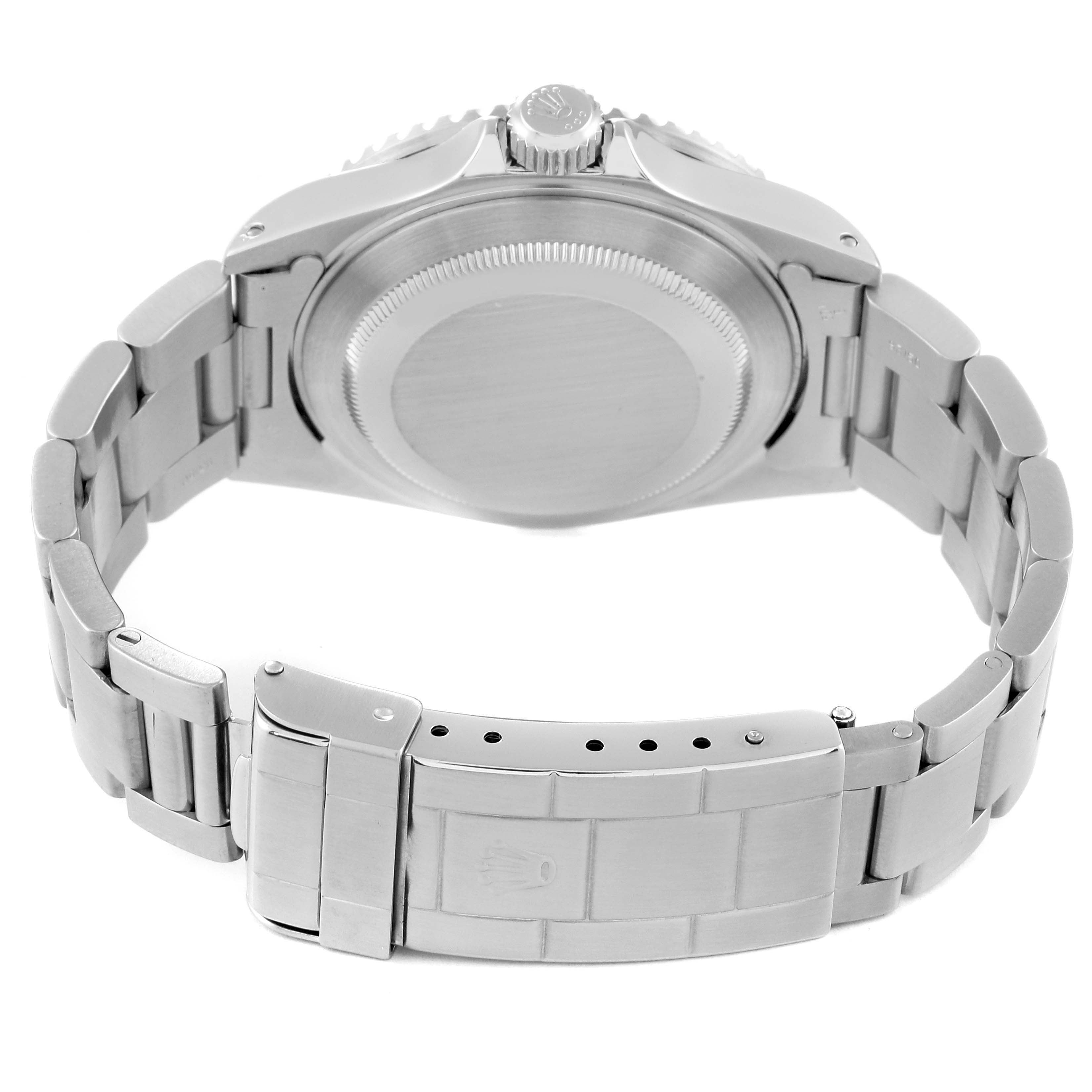 The image shows the backside and bracelet of a Rolex Submariner 16610 Men
s Stainless Steel Black Dial 16610 Men
s Stainless Steel Black Dial, highlighting the clasp and case back.