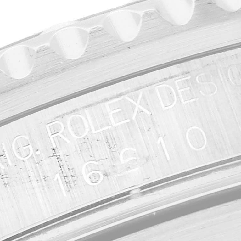 This close-up image shows the engraved details on the bezel of a Rolex Submariner 16610 Men
s Stainless Steel Black Dial 16610 Men
s Stainless Steel Black Dial watch.