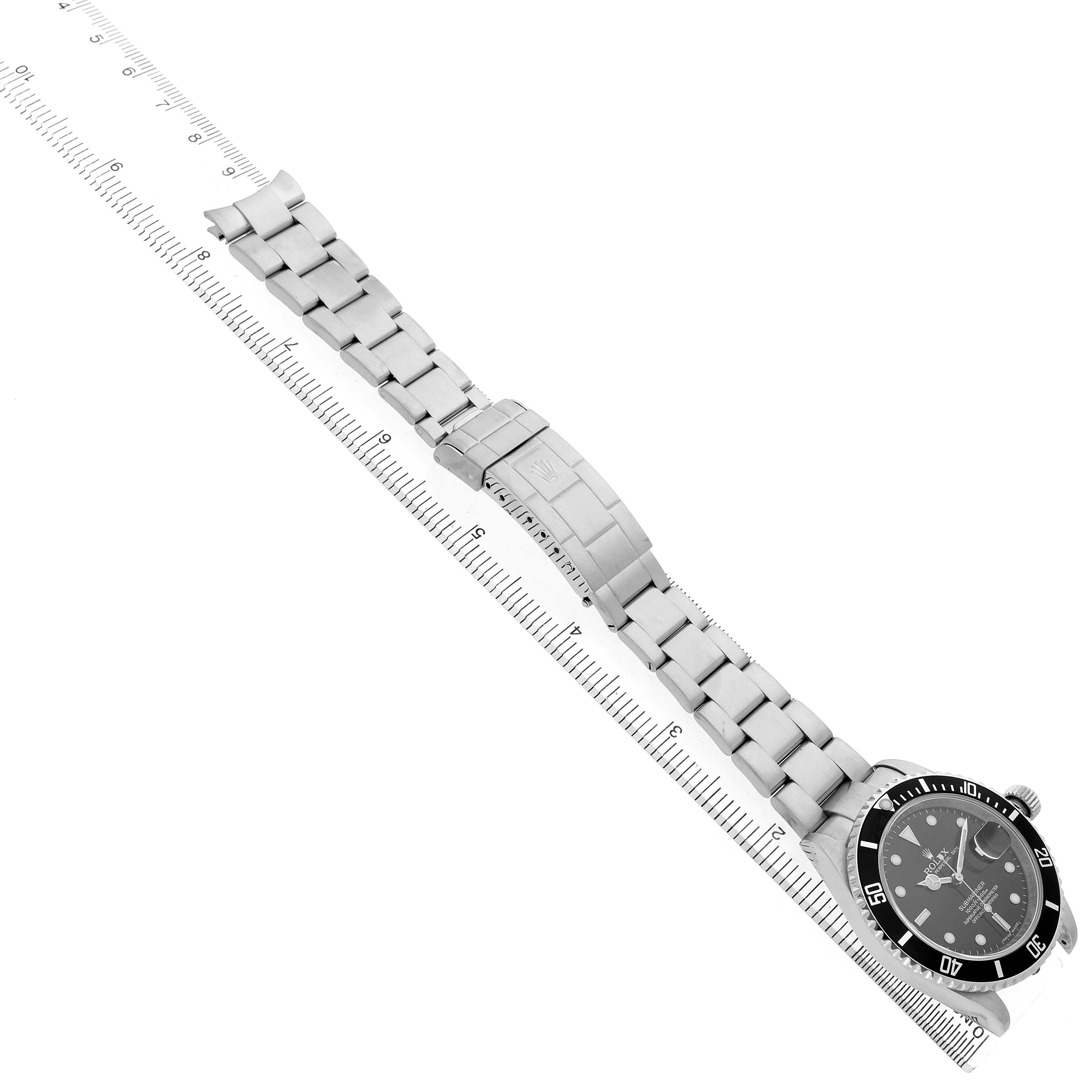 The Rolex Submariner 16610 Men's Stainless Steel Black Dial watch is shown from an angled top view, highlighting the band and clasp along with the watch face.