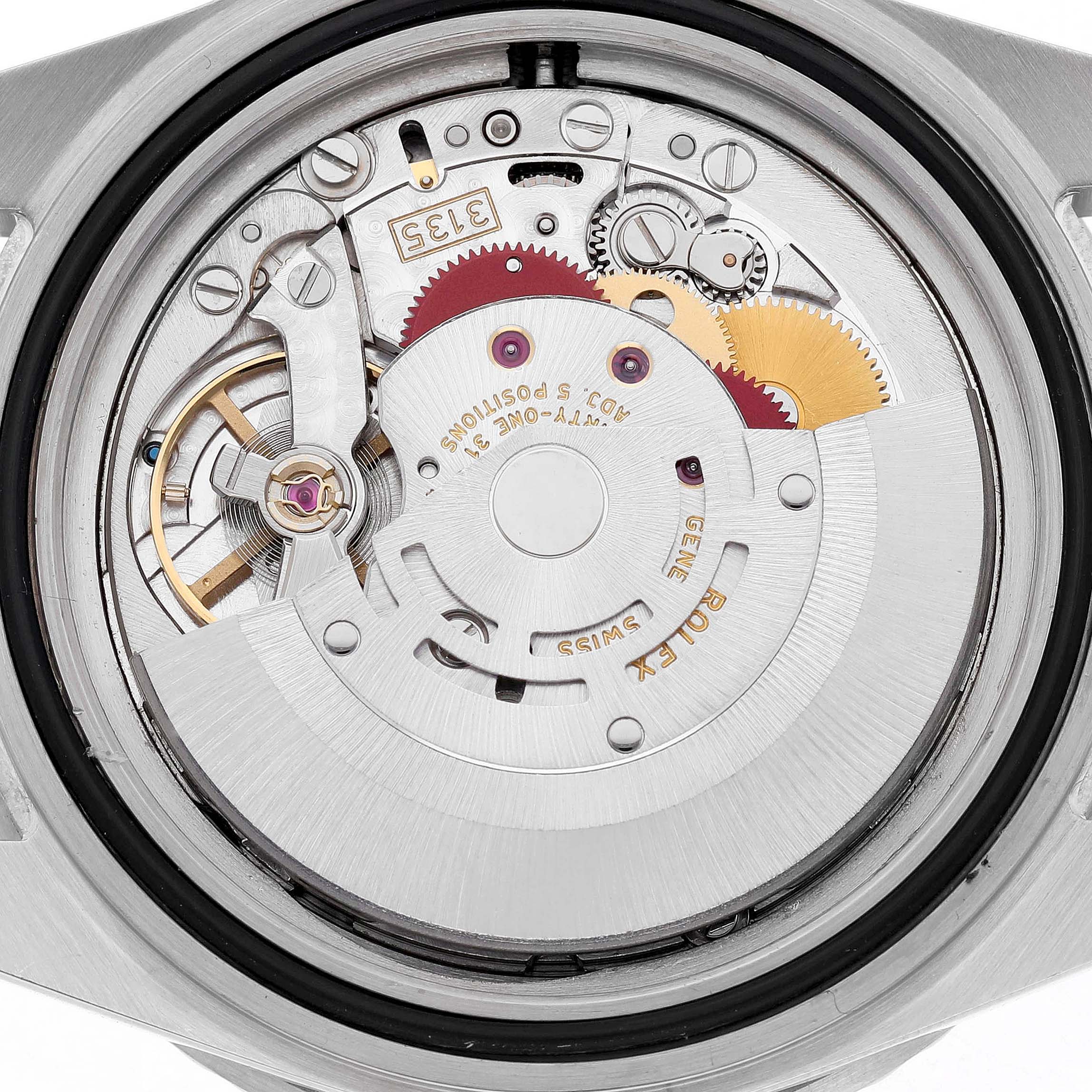 The image shows the internal movement mechanism of a Rolex Submariner 16610 Men's Stainless Steel Black Dial, featuring gears and the rotor.