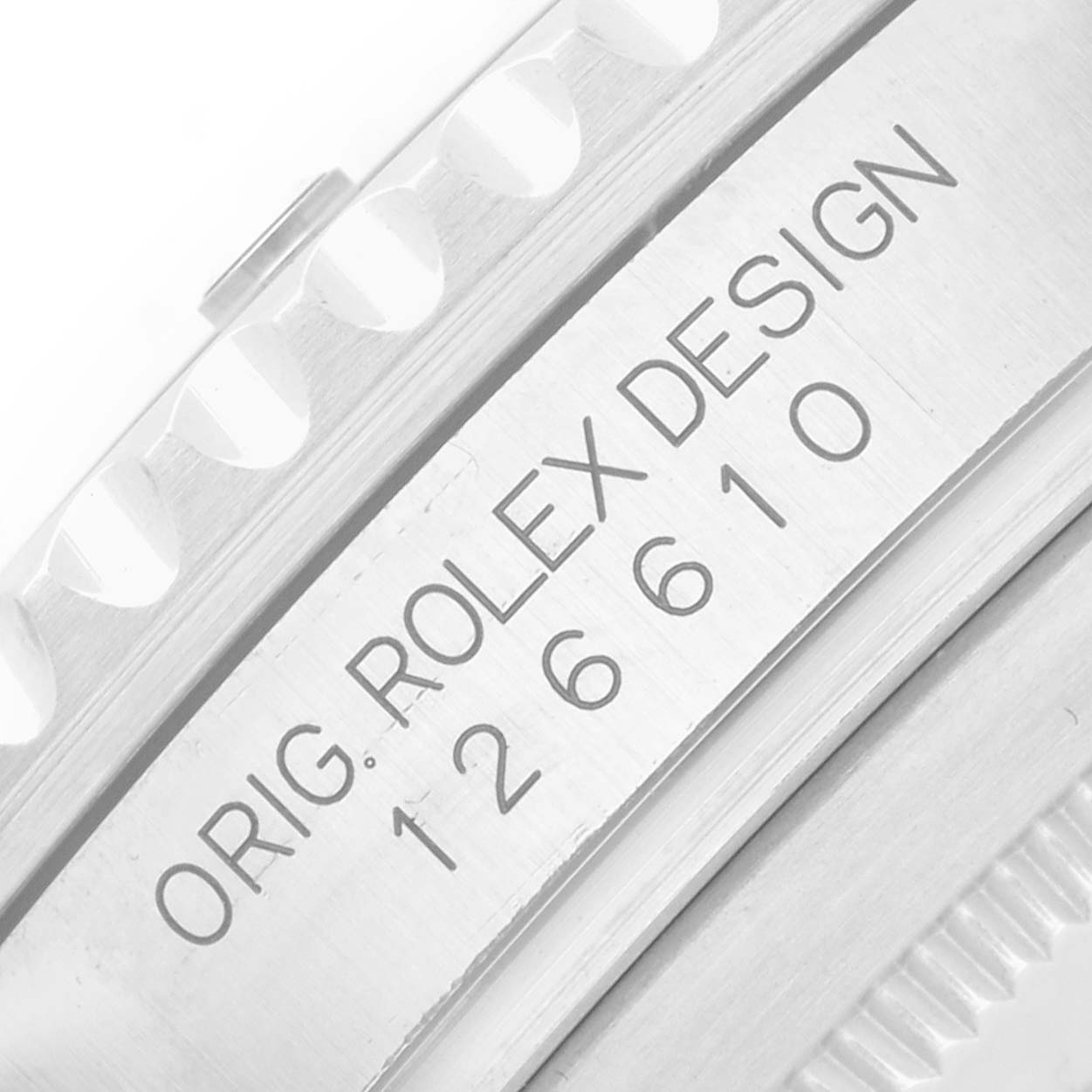 The image shows a close-up of the bezel and engraved serial number of a Rolex Submariner 126610 Men
s Stainless Steel Black Dial.