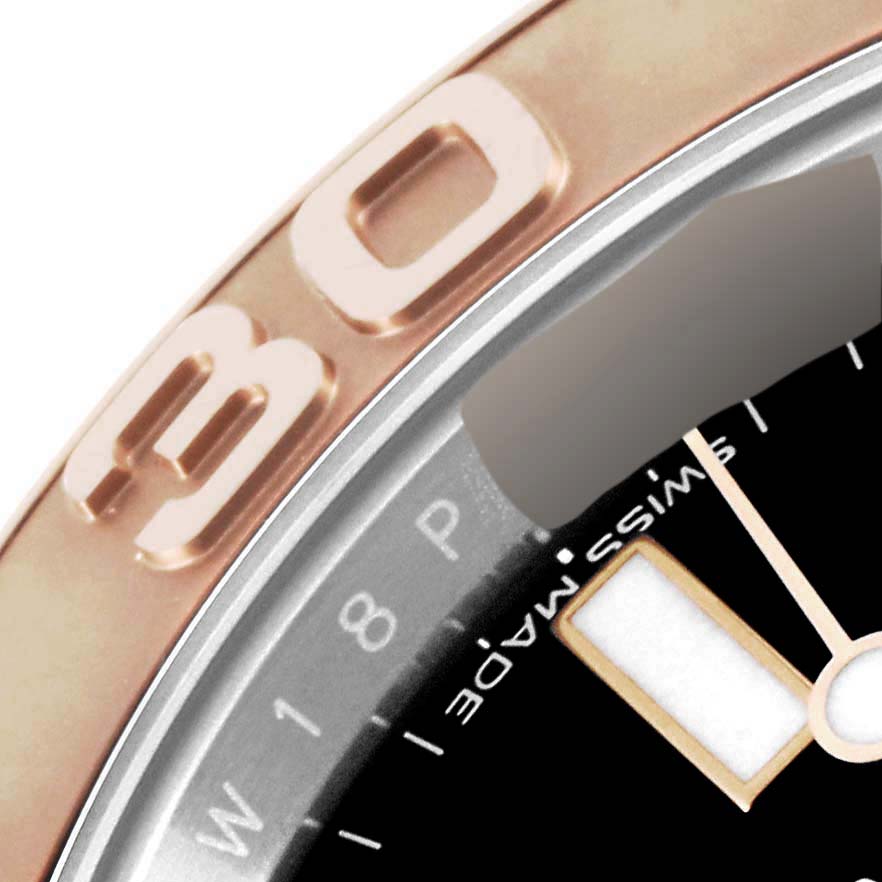 This close-up of the Rolex Yacht-Master 116621 Men
s Steel and Gold (two tone) Black Dial 116621 Men
s Steel and Gold (two tone) Black Dial watch shows the bezel, part of the dial, and a portion of the hour hand.