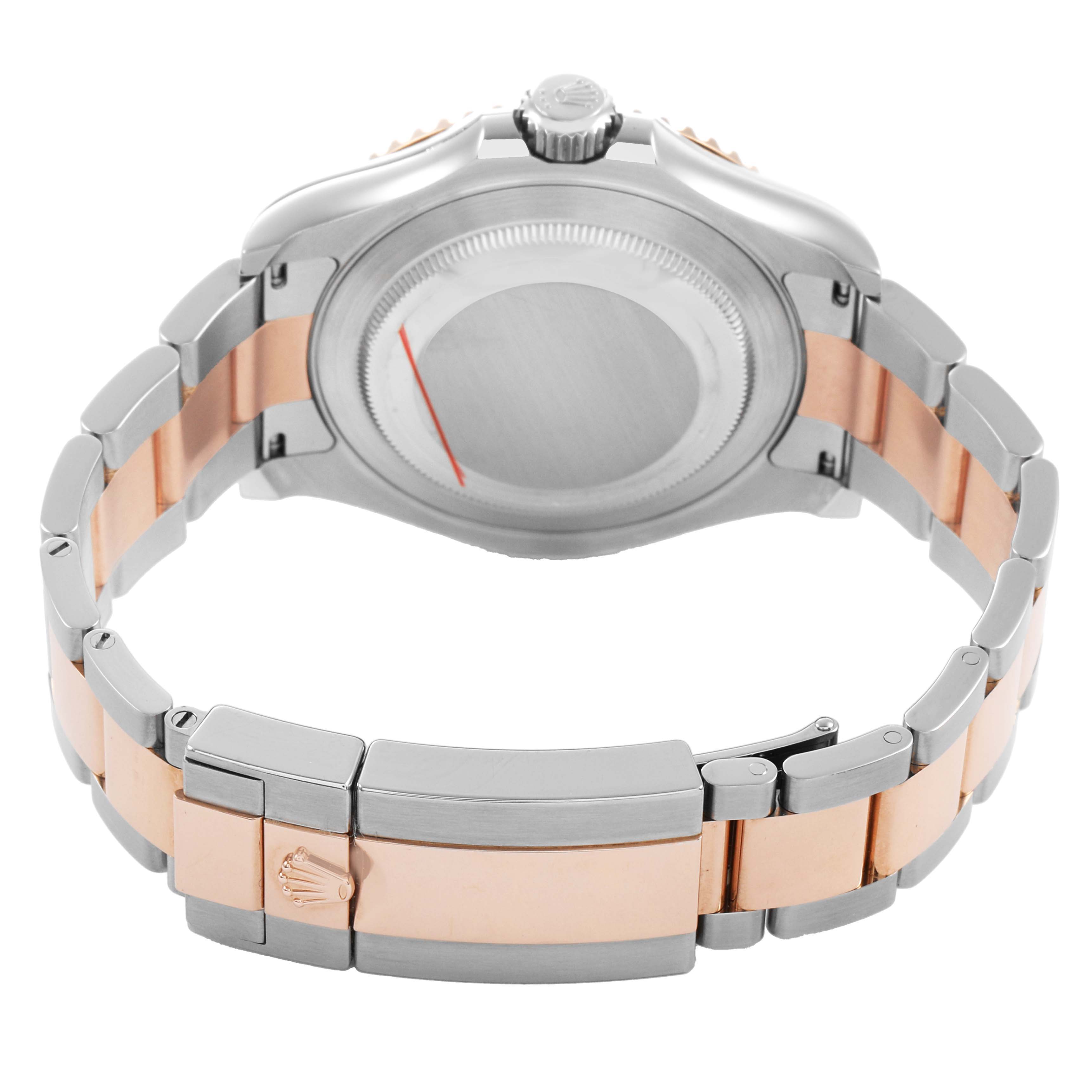 The Rolex Yacht-Master 126621 Men's Stainless Steel Brown Dial watch is shown from the rear, highlighting its case back and two-tone bracelet.