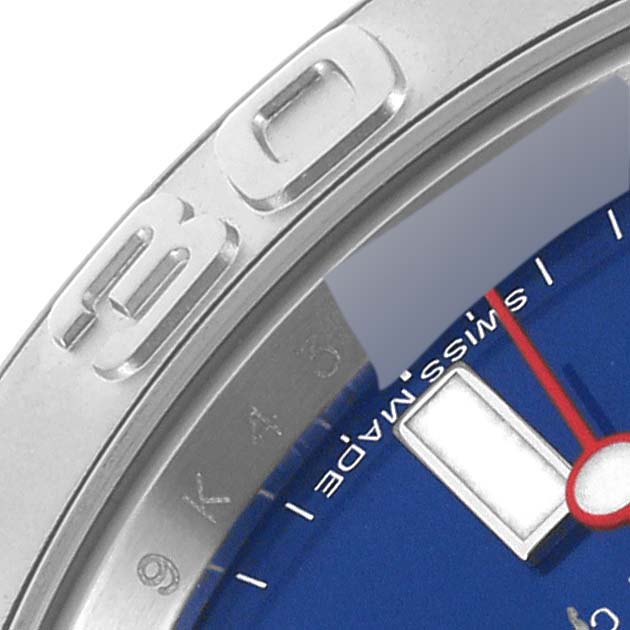 This image shows a close-up of the bezel, blue dial, and part of the hour hand of a Rolex Yacht-Master 116622 Men's Stainless Steel Blue Dial 116622 Men's Stainless Steel Blue Dial watch.