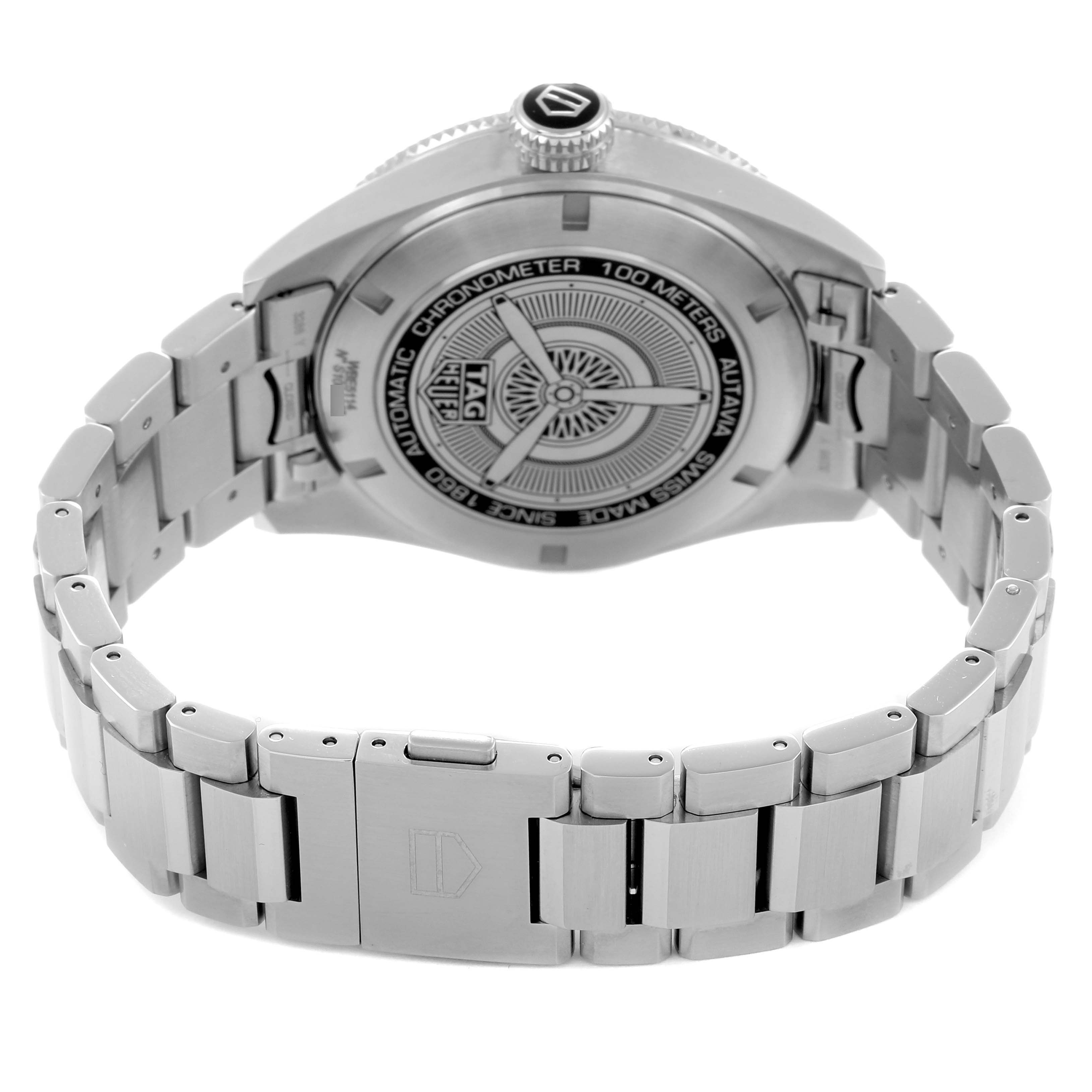 The image shows the back view of a Tag Heuer Autavia WBE5114 Men
s Stainless Steel Brown Dial watch, highlighting the case back and stainless steel bracelet.