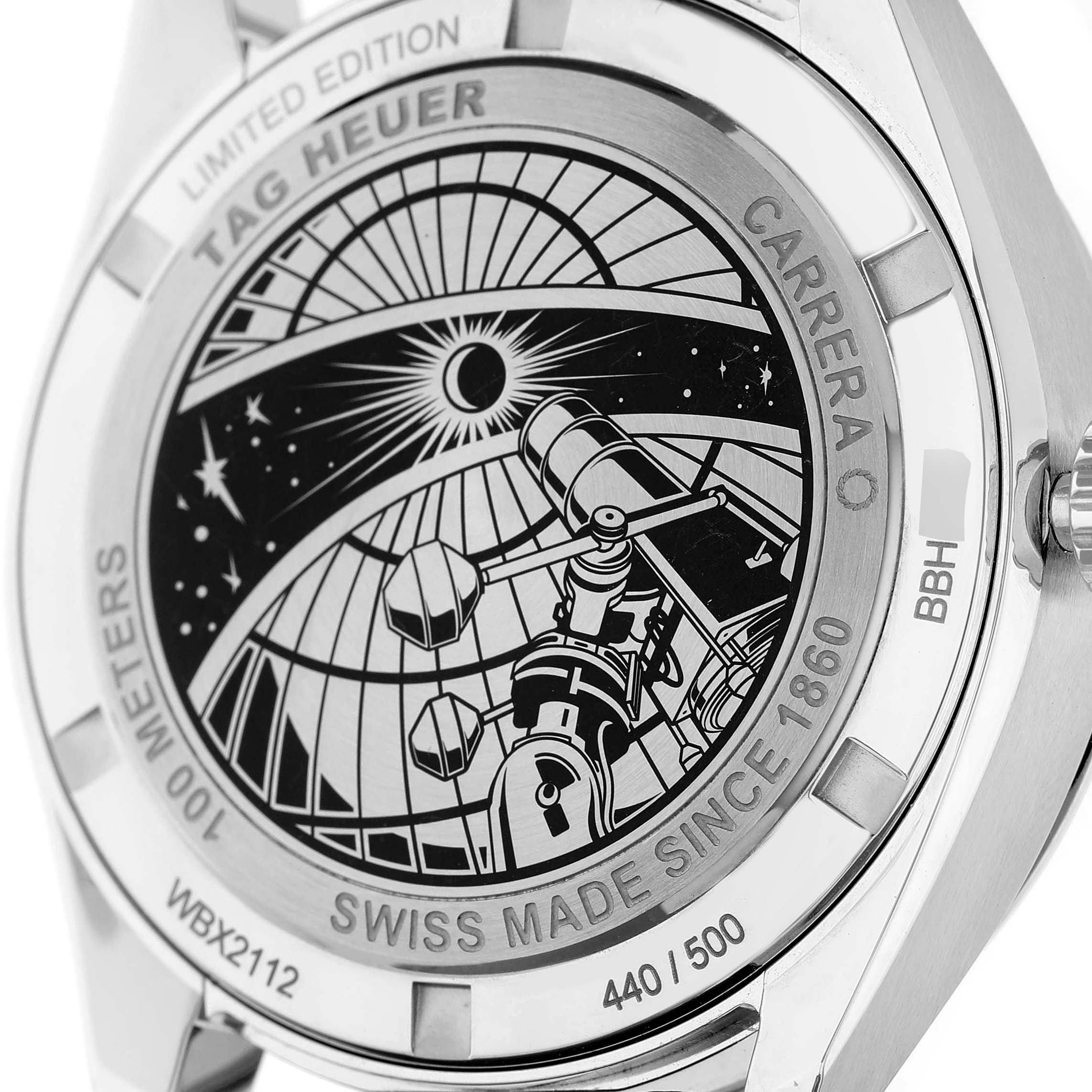 The image shows the back case of a Tag Heuer Carrera WBX2112.FC6615 Men's Stainless Steel Silver Dial watch, featuring an engraved telescope design.