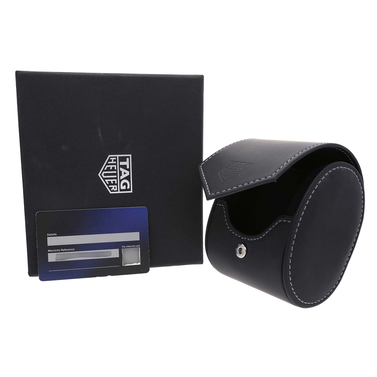 The image shows a Tag Heuer Carrera WBX2112.FC6615 Men's Stainless Steel Silver Dial watch box, leather case, and warranty card from a frontal angle.