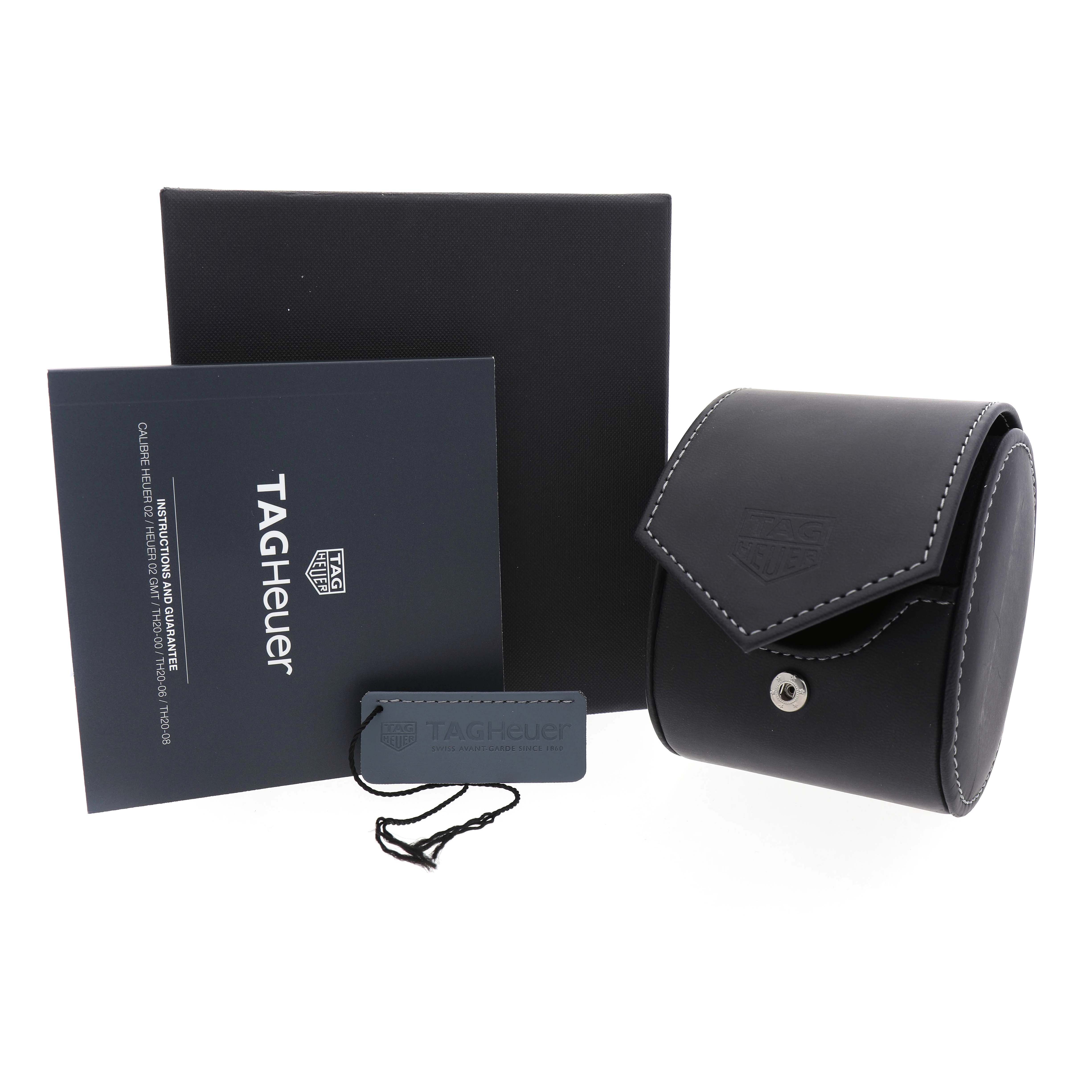 The image shows the Tag Heuer Carrera CBS2219.FC6607 Men's Stainless Steel Purple Dial packaging, including a box, leather case, tag, and warranty booklet.
