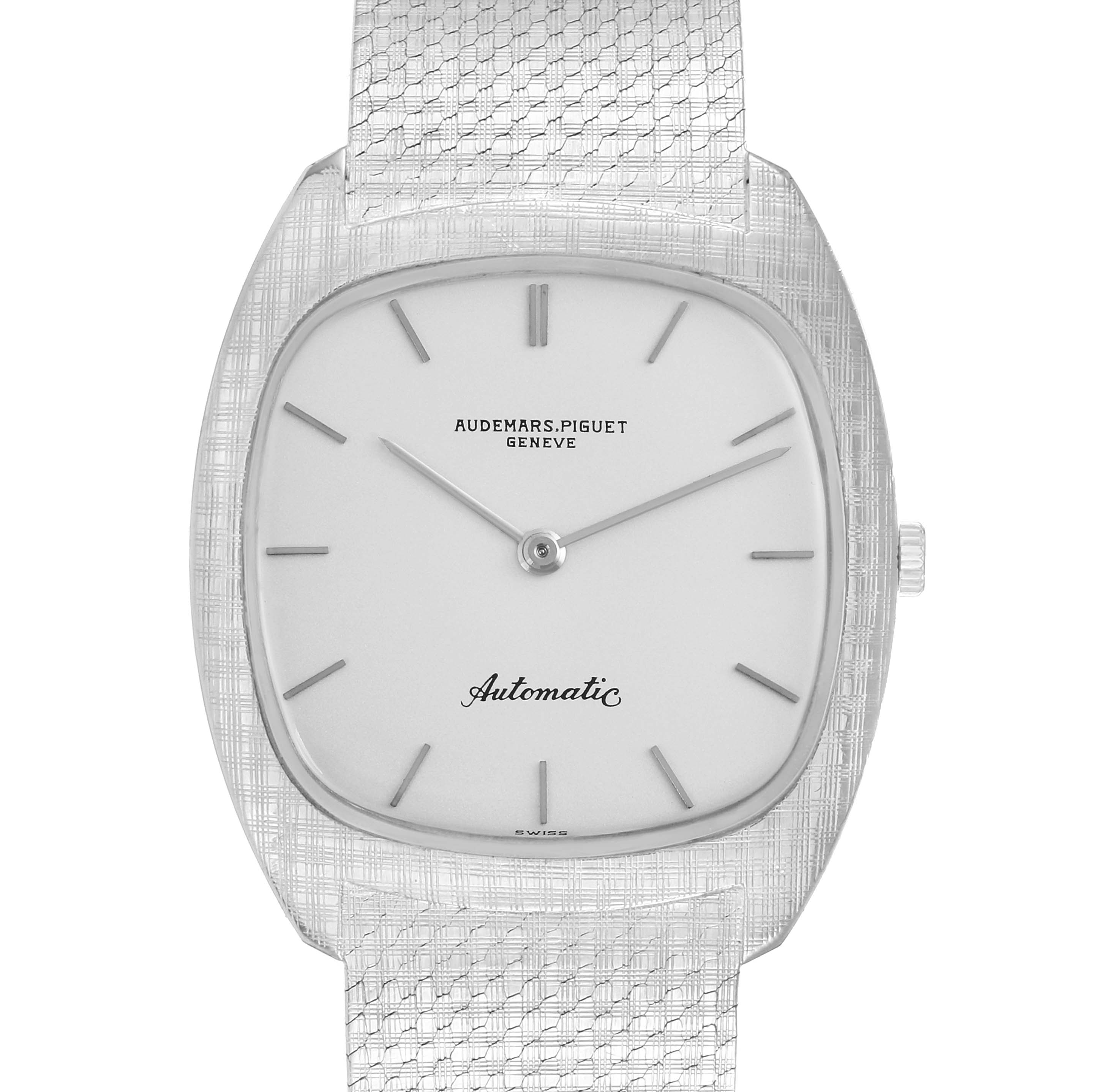 The Audemars Piguet Vintage 5279 Men
s White Gold Silver Dial watch is shown from a front angle, highlighting its dial, hands, and mesh strap.