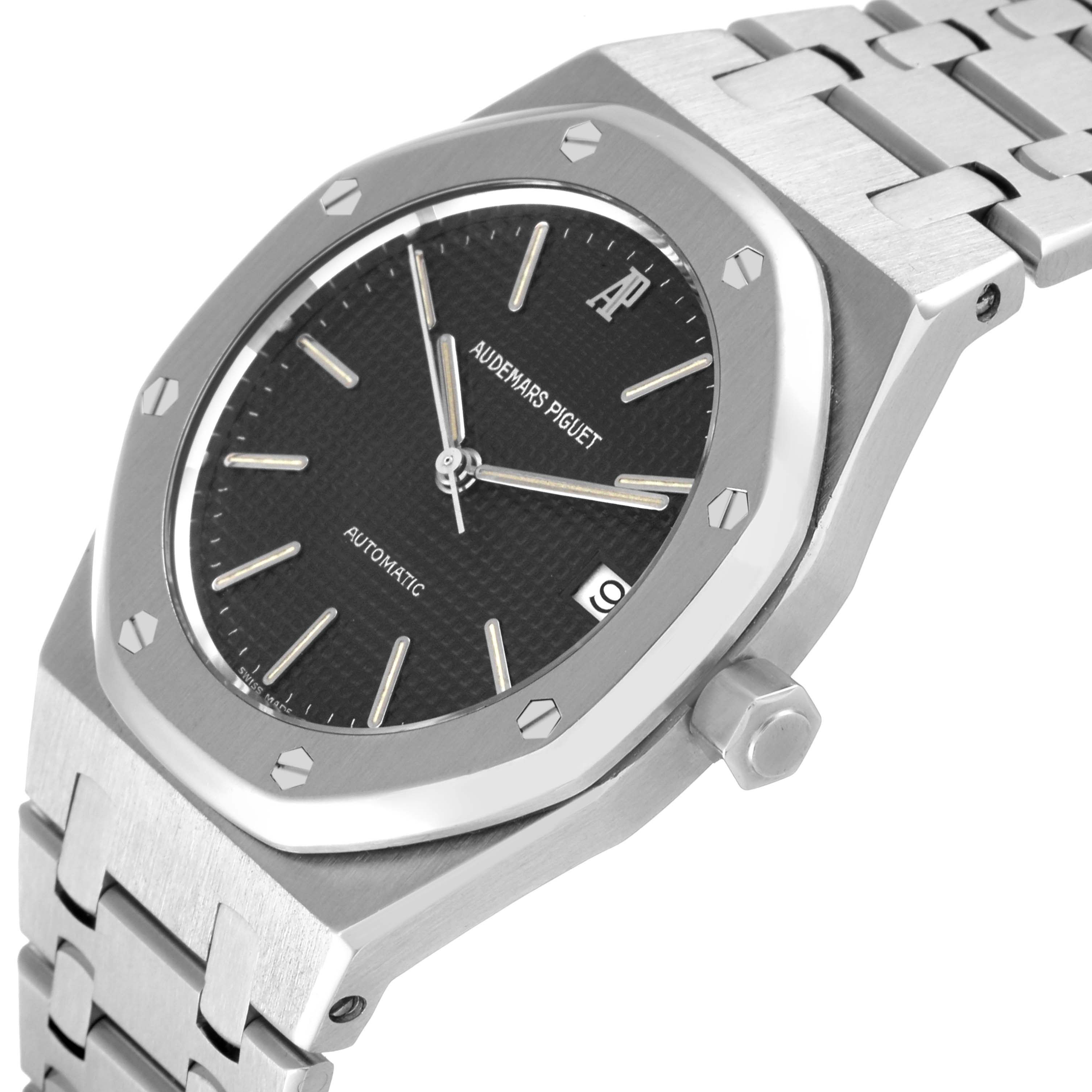 This image shows a side angle of the Audemars Piguet Royal Oak 14790ST Men's Stainless Steel Grey Dial 14790ST Men's Stainless Steel Grey Dial watch, featuring its bracelet, dial, bezel, and crown.