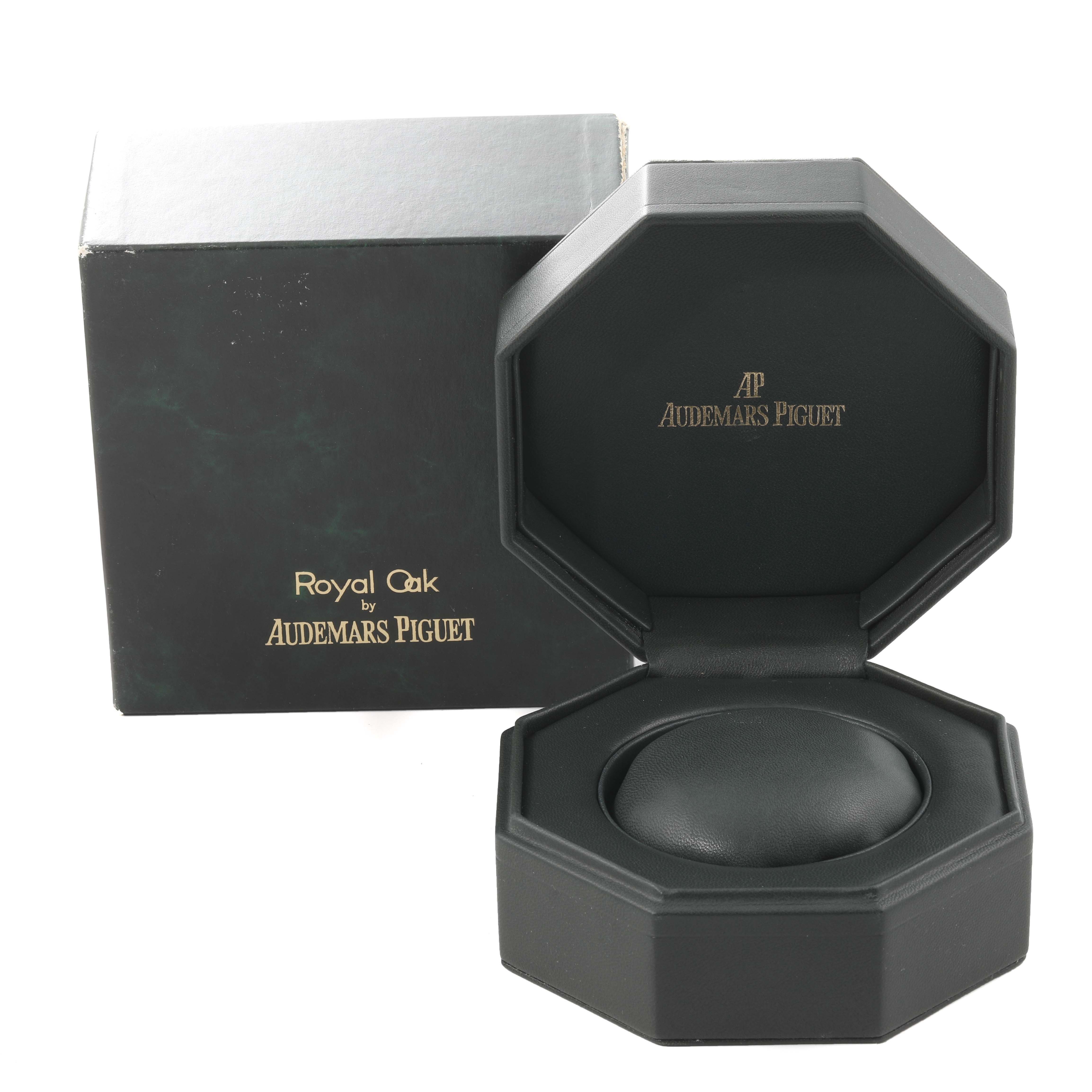 The image shows an open Royal Oak by Audemars Piguet watch box, displaying the empty holder for the watch.