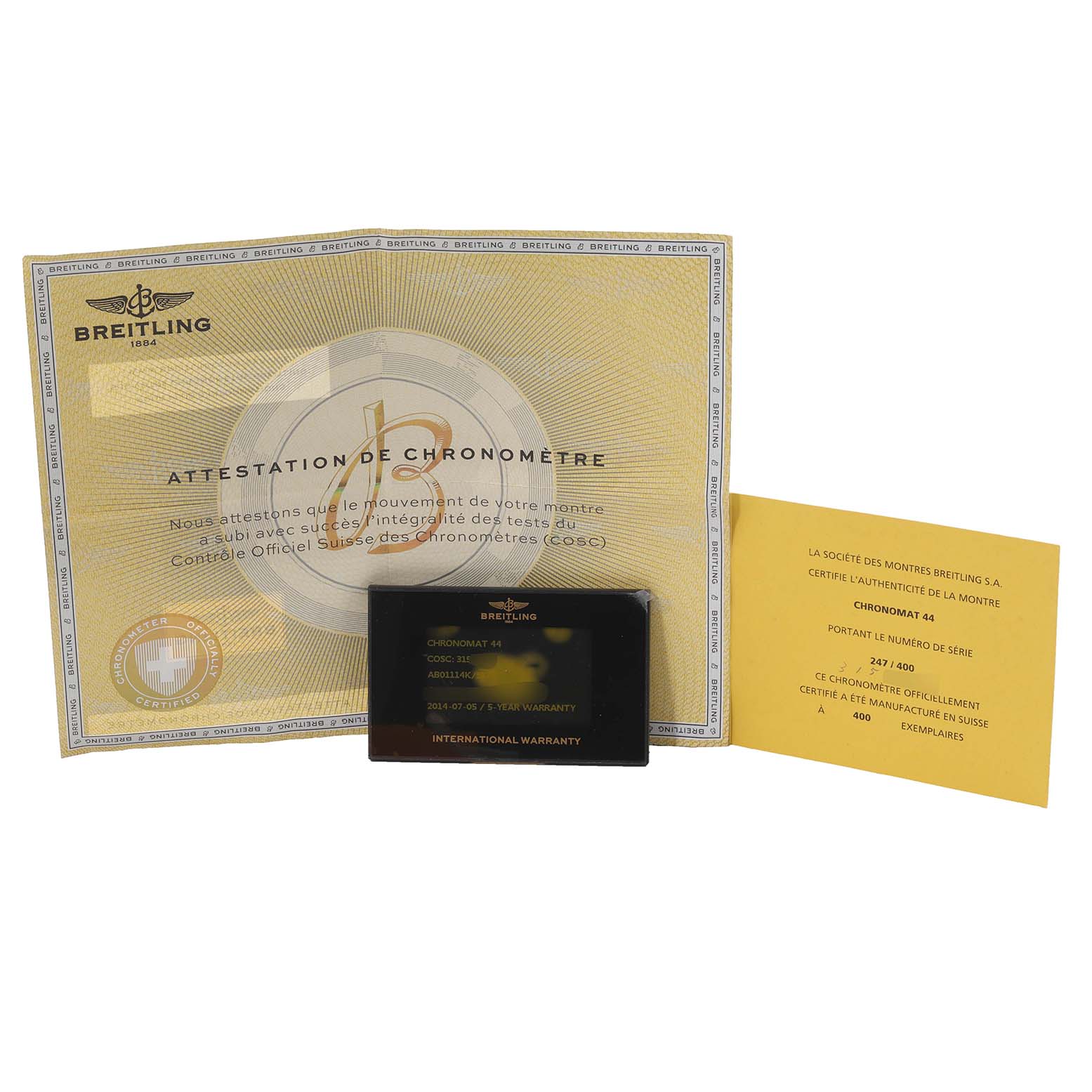 The image shows documentation and warranty cards for a Breitling Chronomat AB01114K/BD34 Men's Stainless Steel Mother of Pearl Dial AB01114K/BD34 Men's Stainless Steel Mother of Pearl Dial watch, including an attestation and an international warranty card.