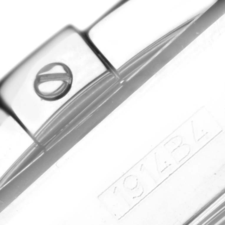 This close-up image of a Breitling Chronomat AB01114K/BD34 Men's Stainless Steel Mother of Pearl Dial AB01114K/BD34 Men's Stainless Steel Mother of Pearl Dial watch shows part of the clasp and a portion of the bracelet with a visible screw and serial number.