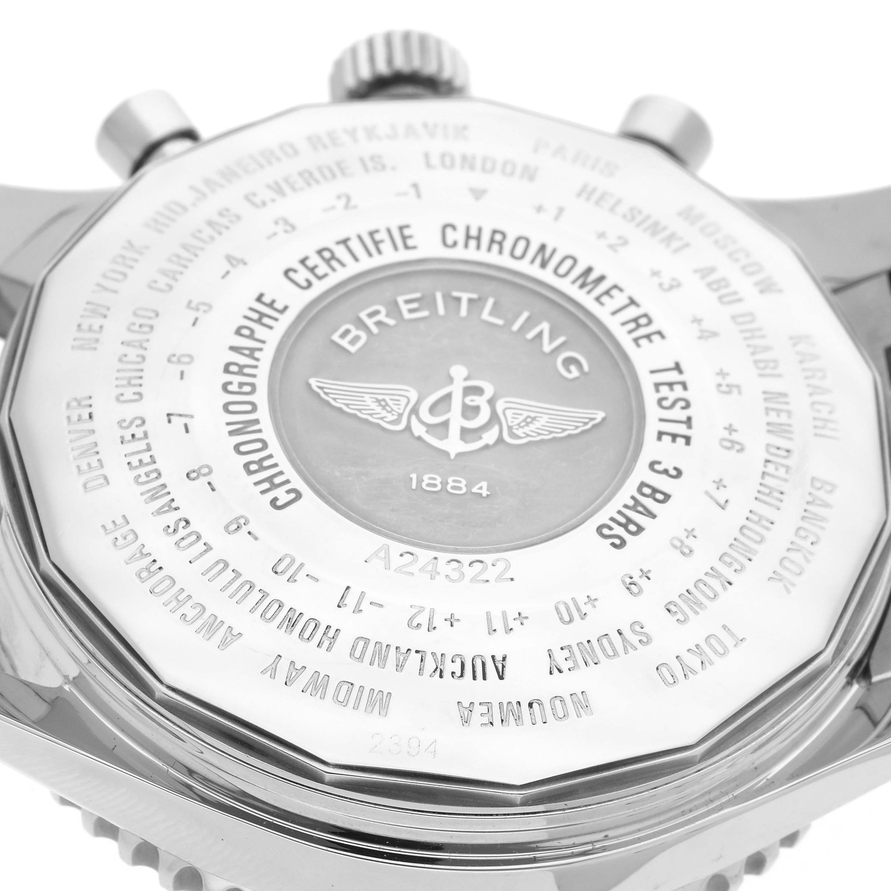 The image shows the back of a Breitling Navitimer A24322 Men's Stainless Steel Black Dial A24322 Men's Stainless Steel Black Dial watch, featuring engraved details and the brand's logo.