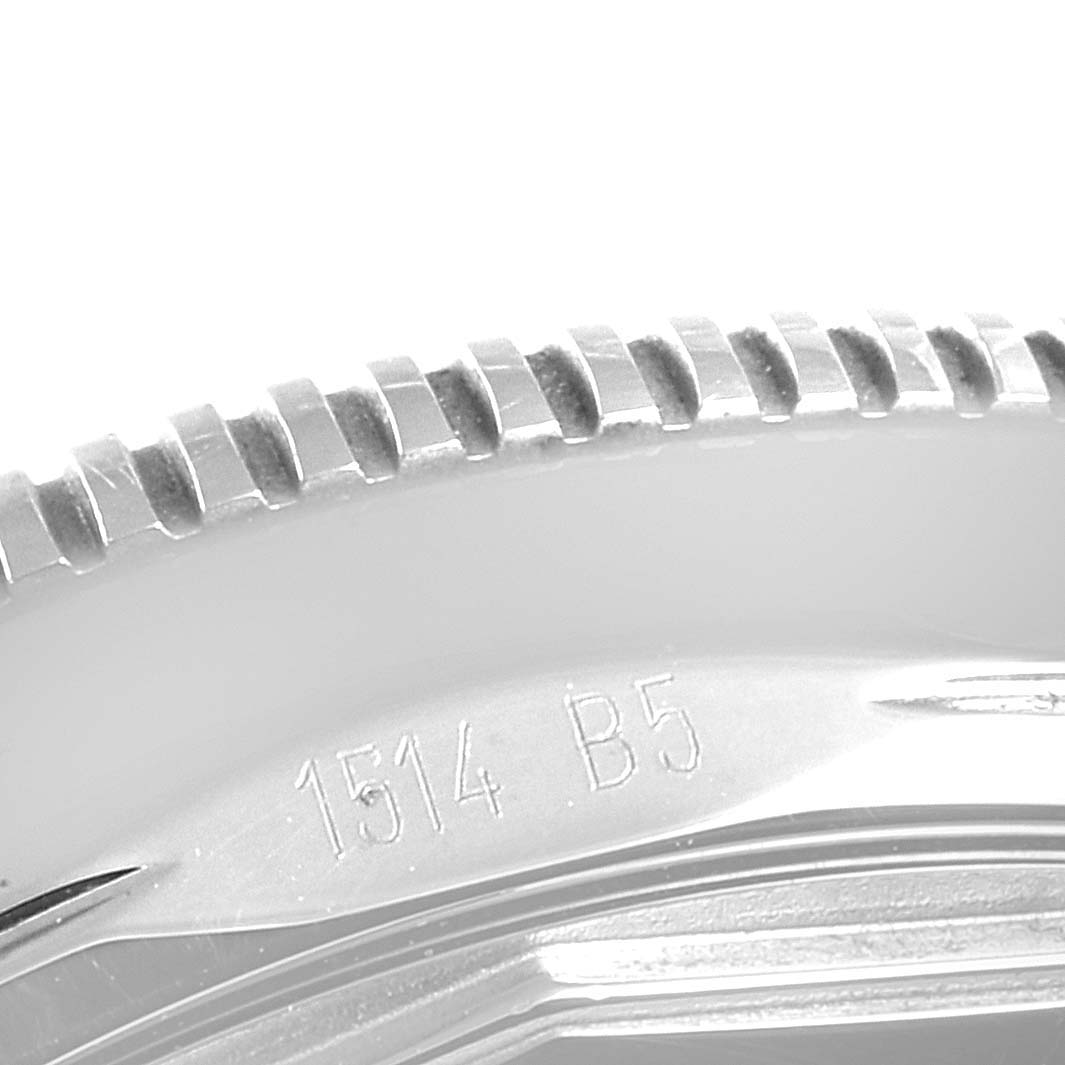 This close-up image shows the textured bezel and part of the engraved case back of a Breitling Superocean A17321 Men's Stainless Steel Black Dial A17321 Men's Stainless Steel Black Dial watch.