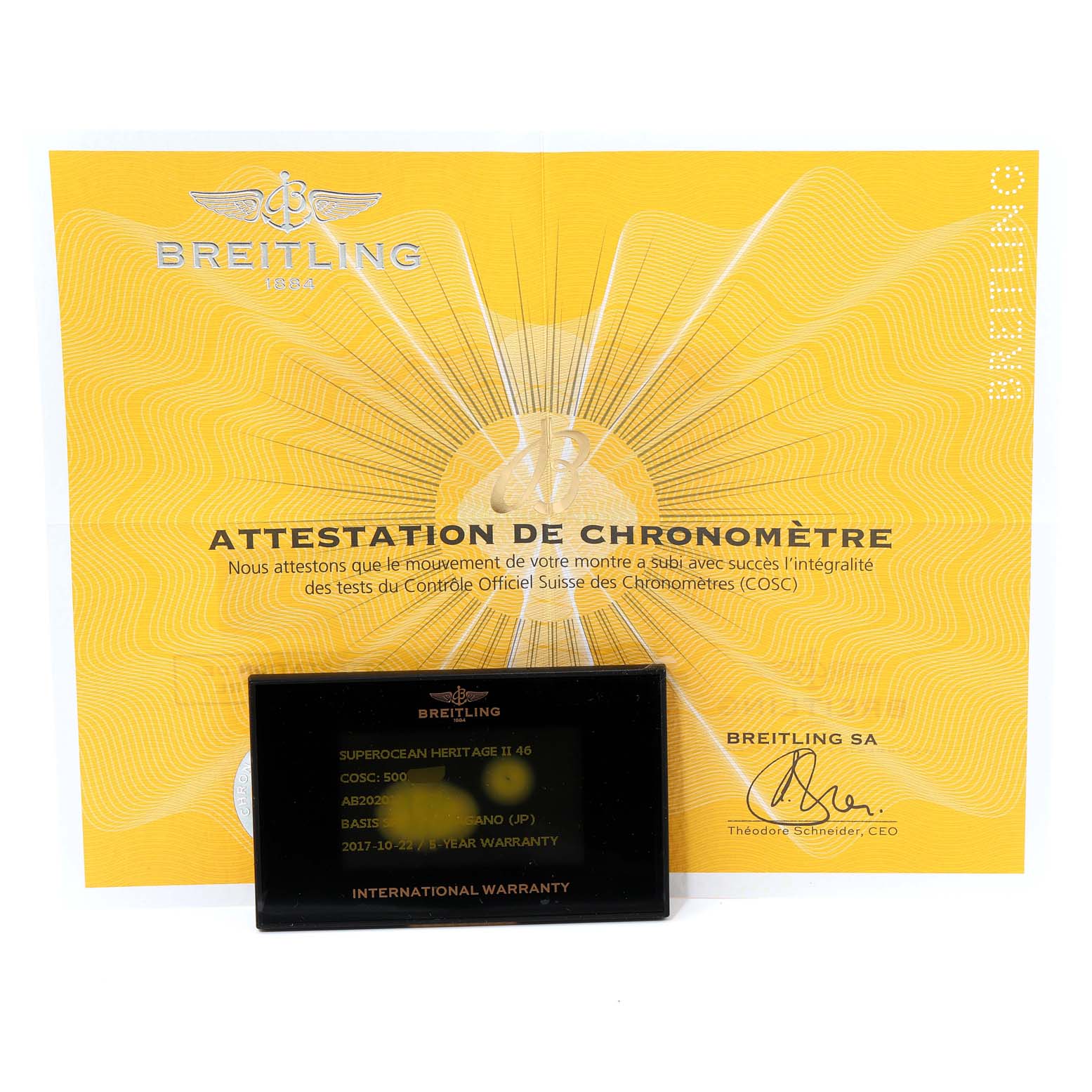 The image shows a Breitling Superocean AB202016-C961-152A Men's Stainless Steel Silver Dial AB202016-C961-152A Men's Stainless Steel Silver Dial model attestation certificate and an international warranty card, displayed from a front angle.