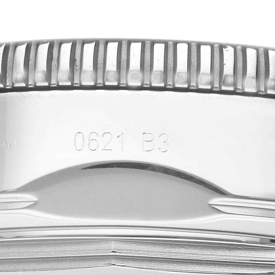 This is a close-up of the side of a Breitling Superocean AB2010 Men
s Stainless Steel Black Dial AB2010 Men
s Stainless Steel Black Dial watch, showing the edge of the bezel and engraved model numbers.