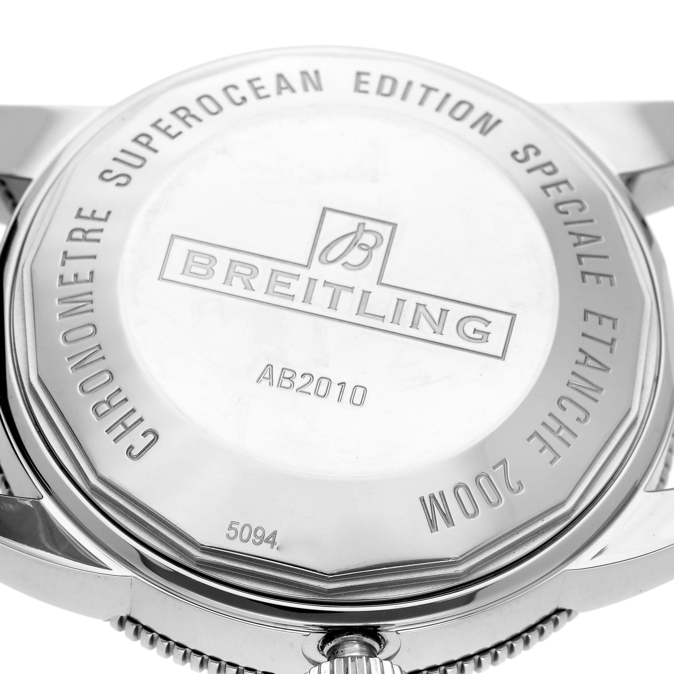 This image shows the back case of a Breitling Superocean AB2010 Men
s Stainless Steel Black Dial AB2010 Men
s Stainless Steel Black Dial watch from a close-up, angled view.