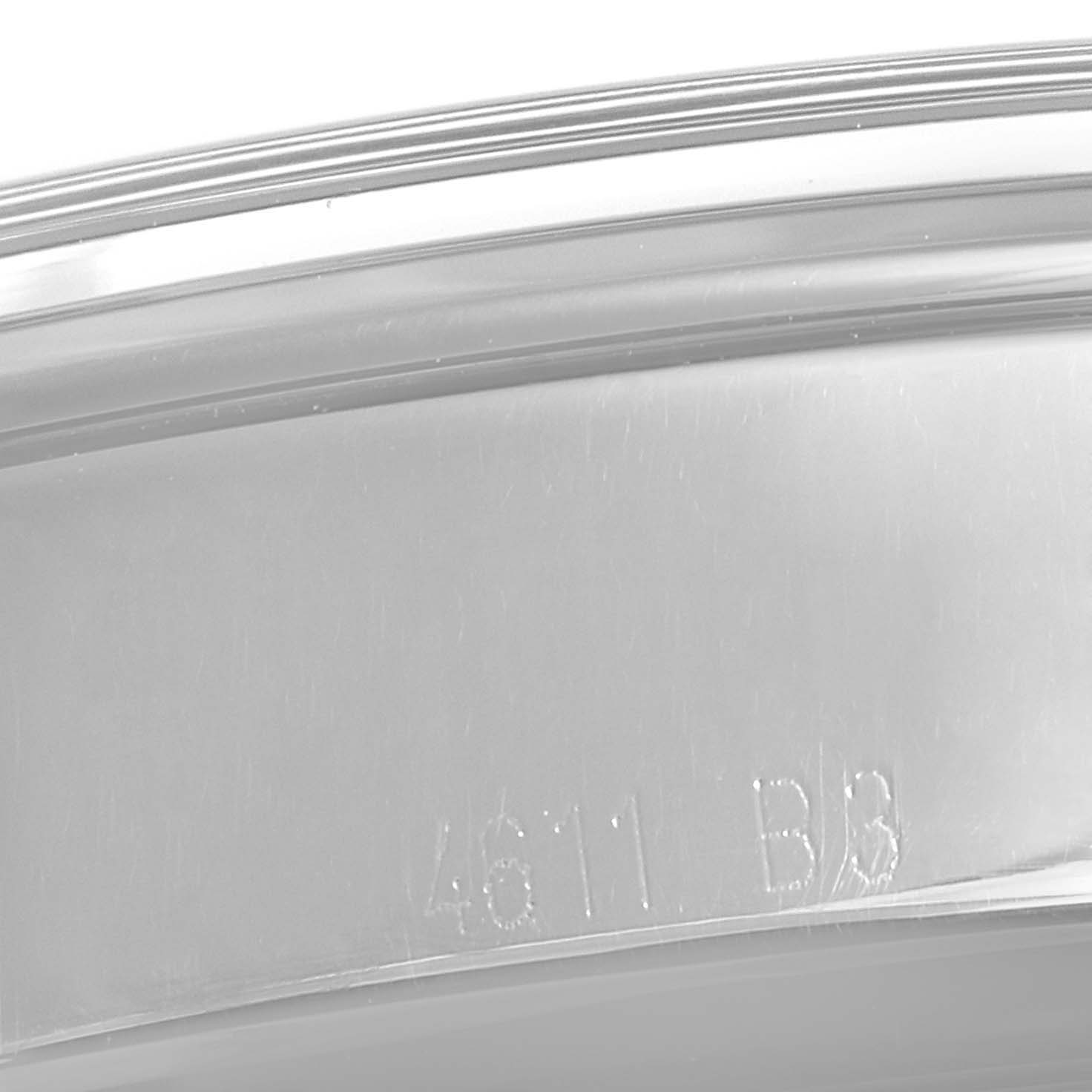 The image shows a close-up view of the outer edge of a Breitling Transocean AB015212/G724-743P Men's Stainless Steel Silver Dial AB015212/G724-743P Men's Stainless Steel Silver Dial watch case, showcasing part of its engraved markings.